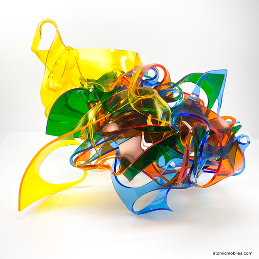 Sculptura Art Sculpture for tabletop, shelf, or desk -- incredibly unique abstract art made of curved transparent acrylic plexiglass, one of a kind modern art sculpture in yellow, green, blue, and orange by AtomicMobiles.com