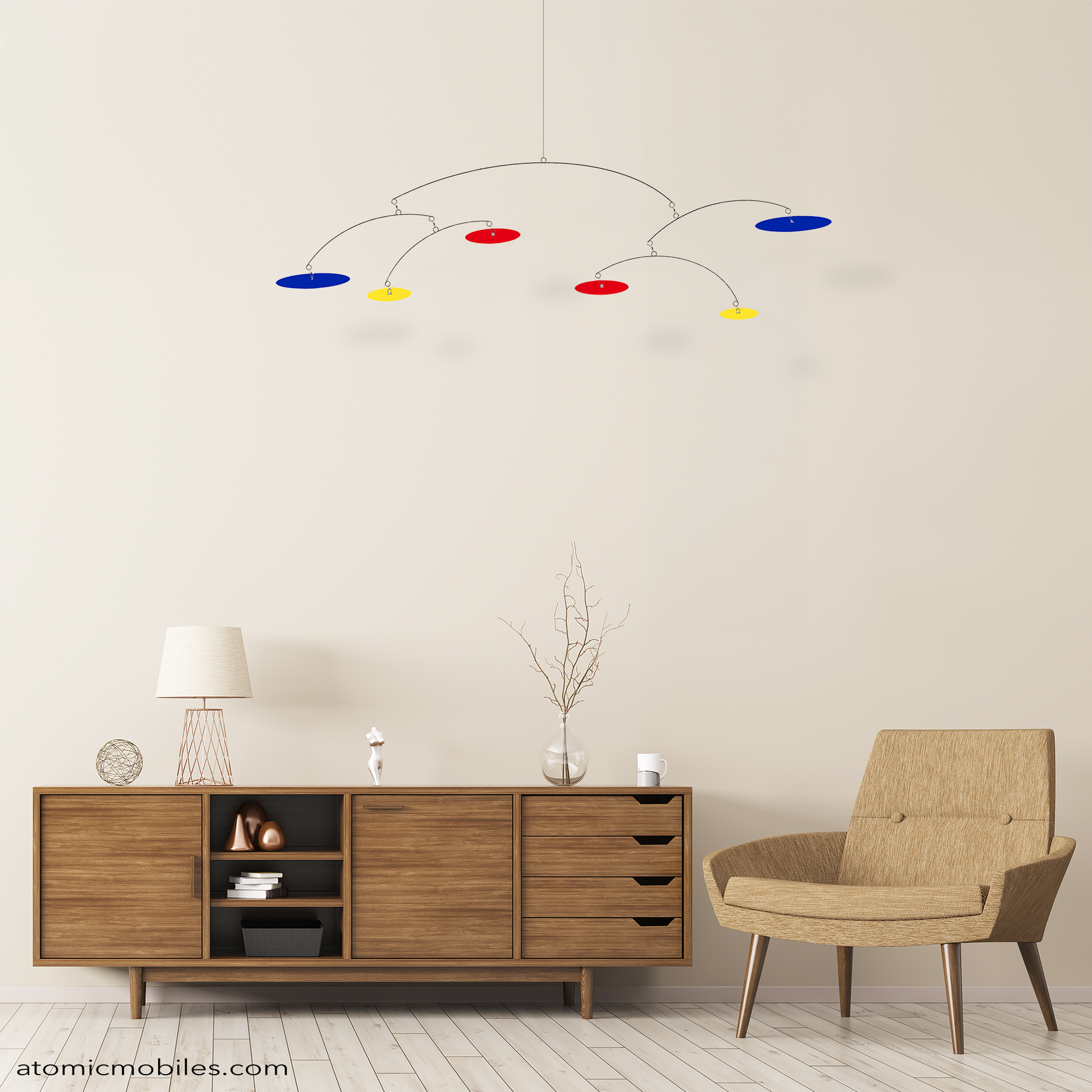 PARIS modern hanging art mobile in red, blue, and yellow, in mid century modern room with wood credenza, and MCM chair - kinetic mobile by AtomicMobiles.com