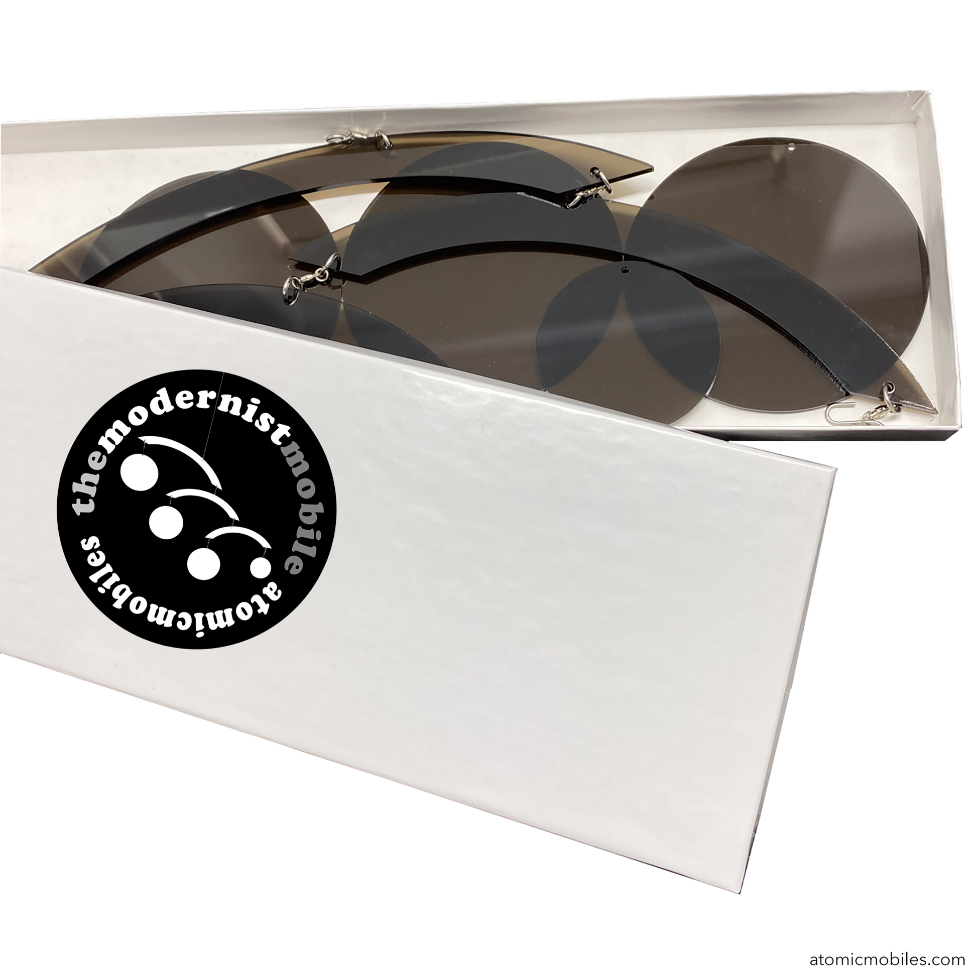 Box featuring The Modernist Mobile in transparent groovy bronze color by AtomicMobiles.com