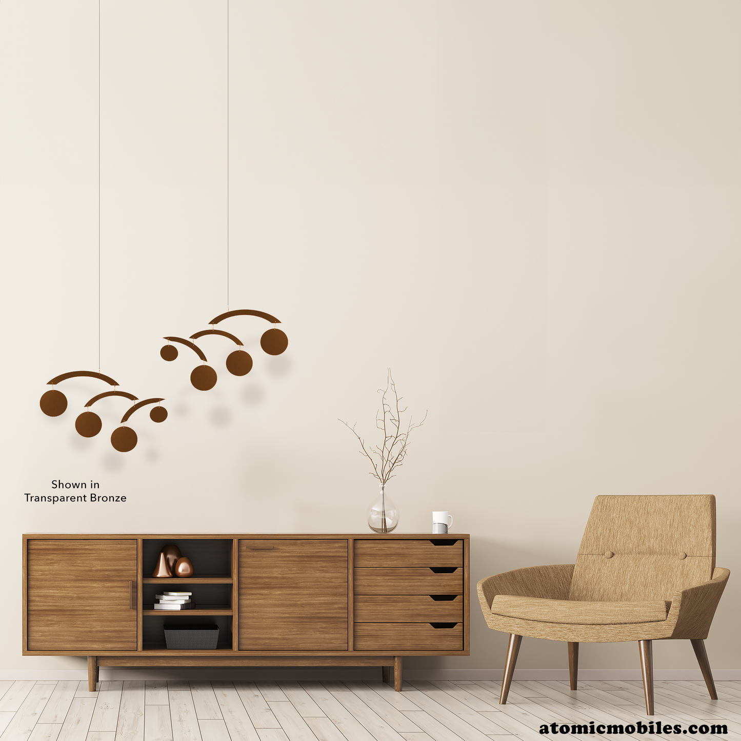 Beautiful mid century modern room with wood credenza, tan color MCM chair, wood floor and transparent bronze hanging art mobiles called The Modernist Mobiles by AtomicMobiles.com