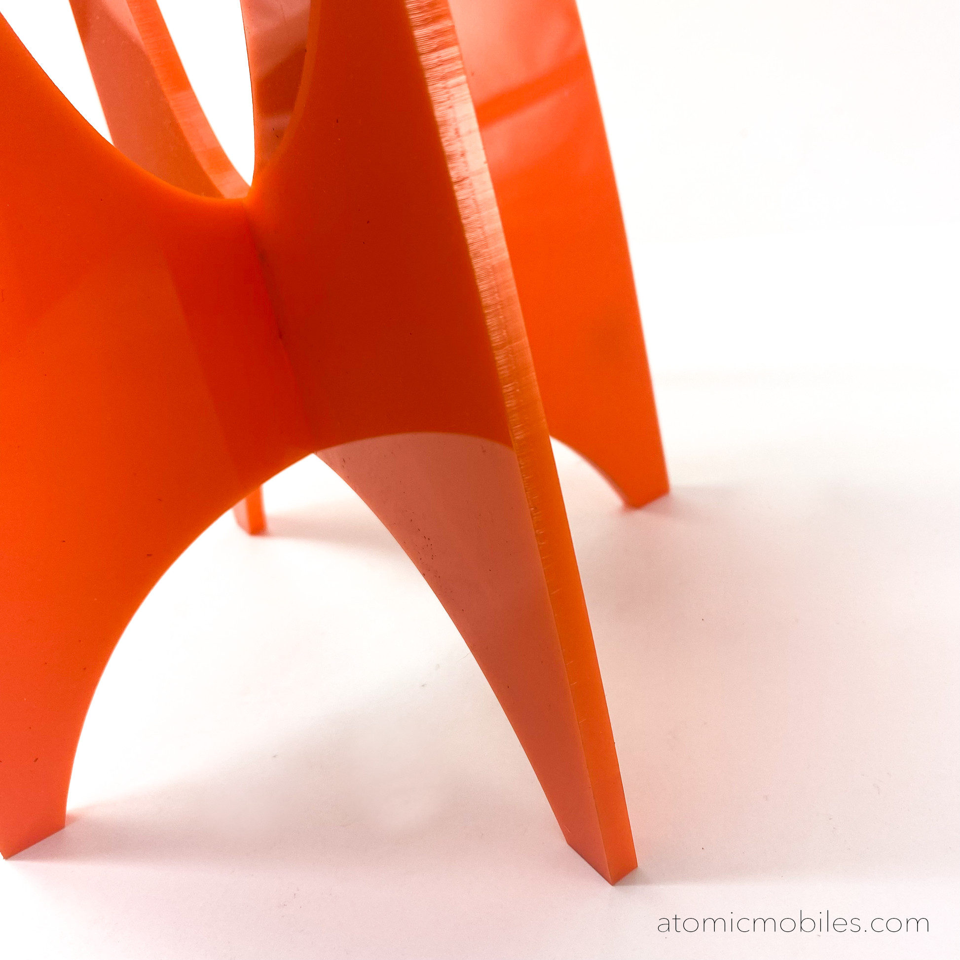 Closeup of base of orange Beatnik Party Lamp by AtomicMobiles.com