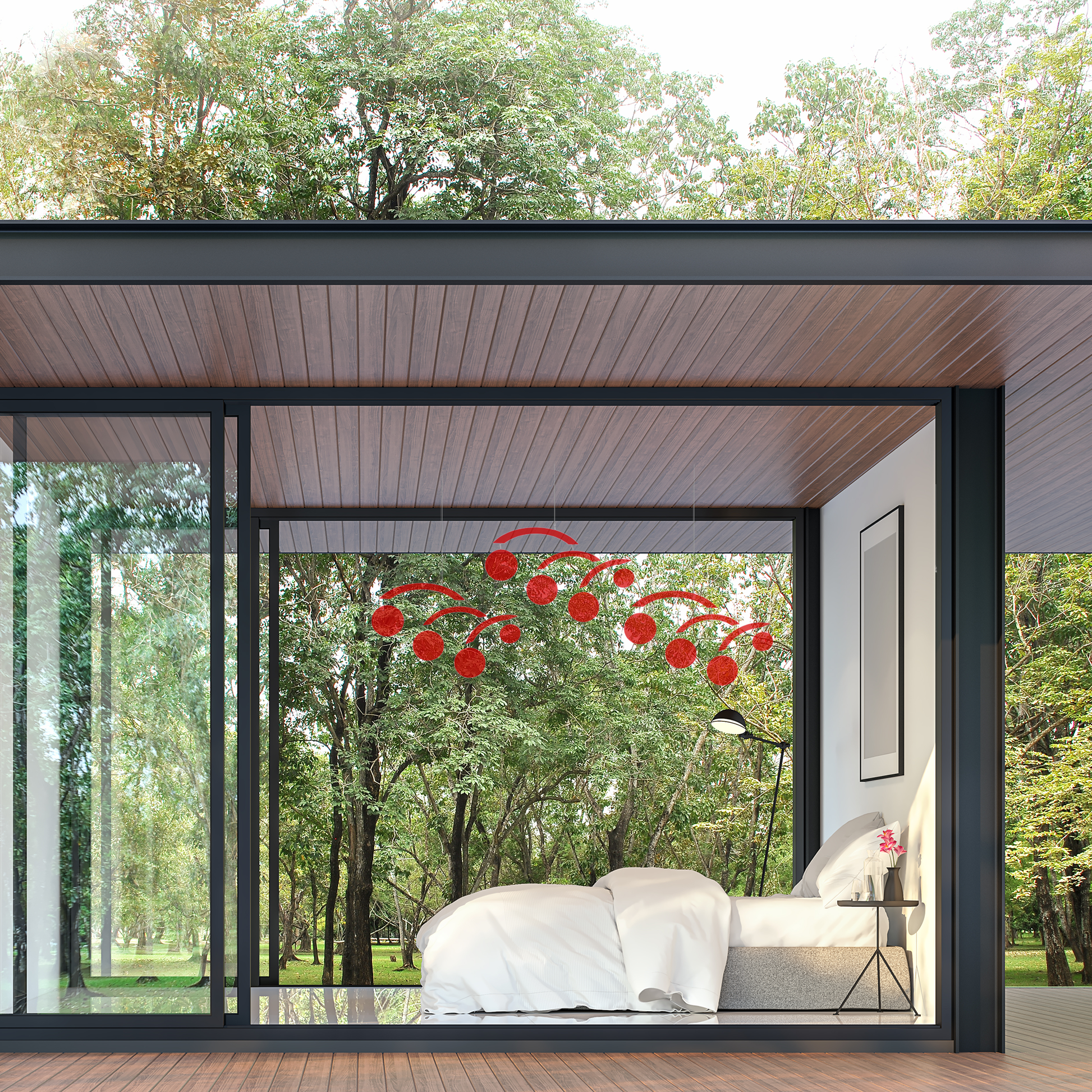 A modern bedroom with 3 Modernist Jetsetter clear acrylic art mobiles hanging from the ceiling over the bed. The mobiles consists of red circles that appear to be in motion, adding a dynamic visual element -- mobiles by AtomicMobiles.com