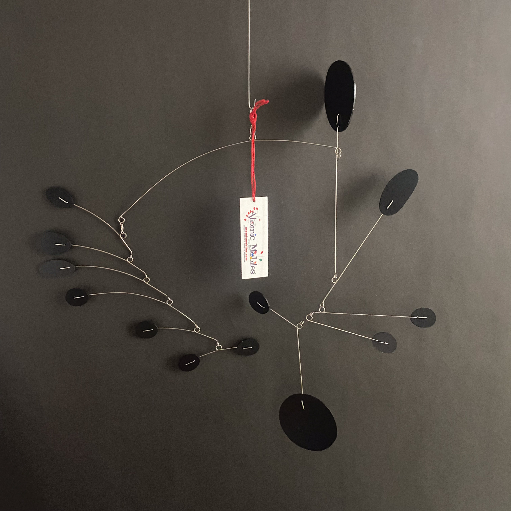 Beautiful all black Papillon hanging art mobile on a black background - made and ready to ship by Atomic Mobiles