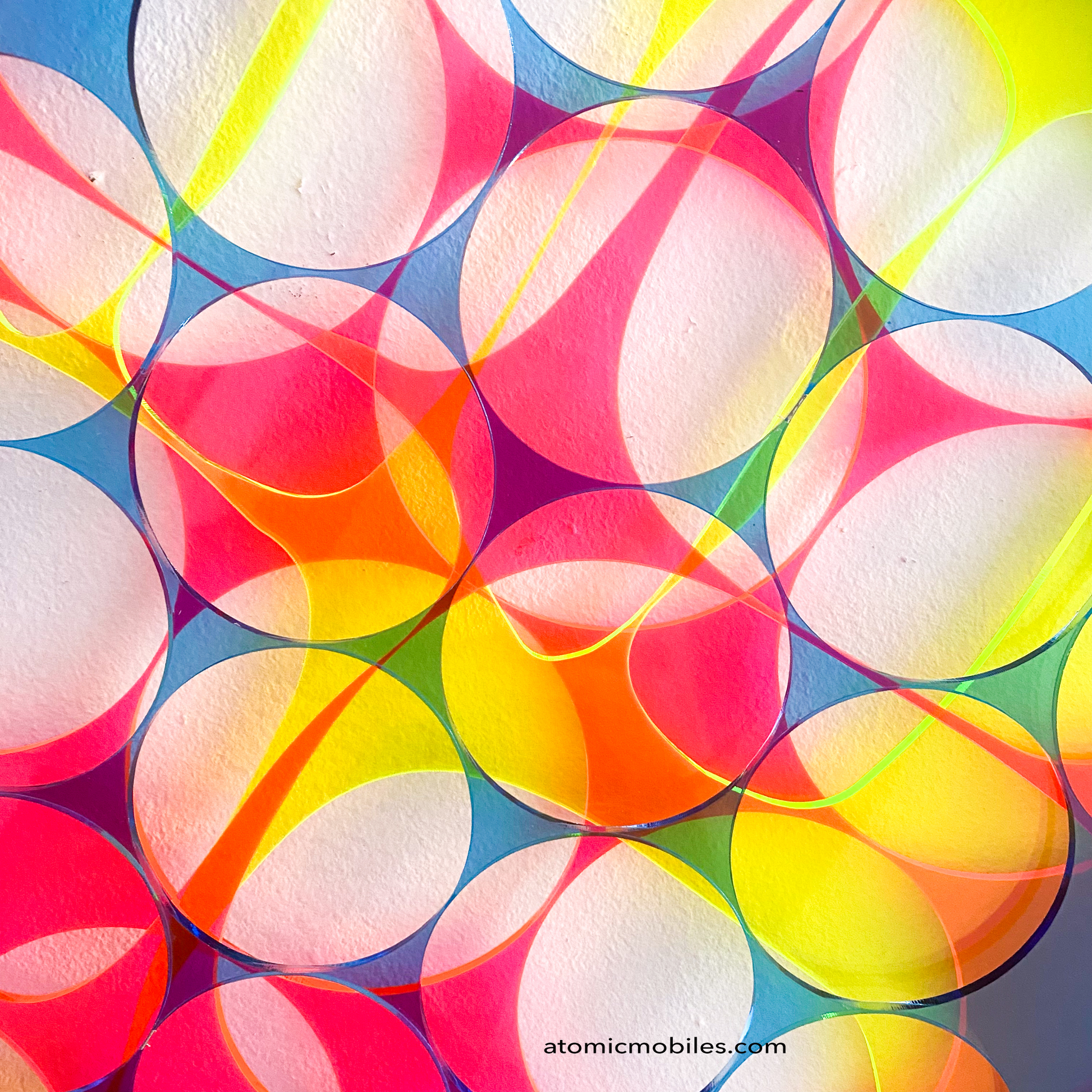 Close up of 3D Abstract Wall Art Panel in hot pink, blue, and fluorescent green by AtomicMobiles.com