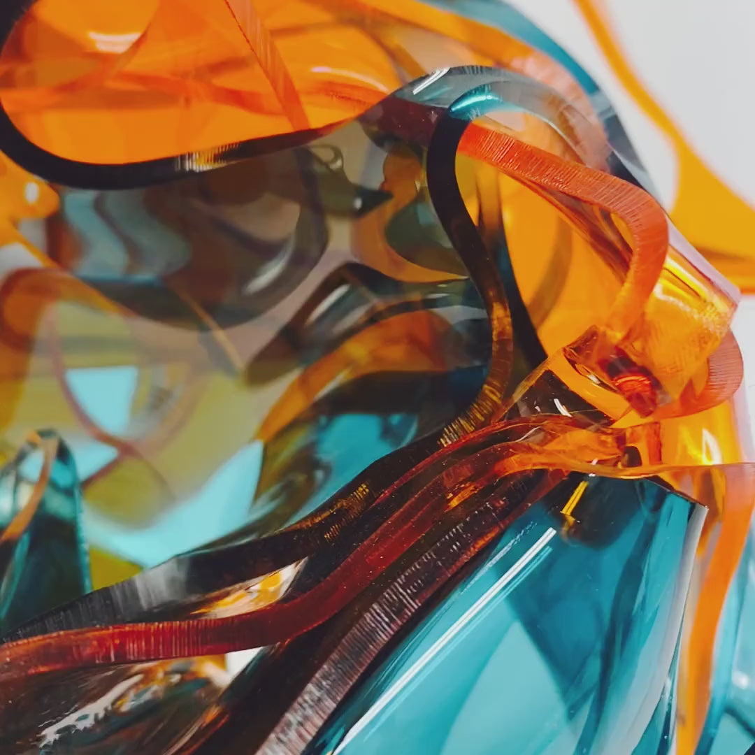 video of colorful abstract sculpture in transparent orange, teal, and blue plexiglass acrylic on a white background titled Radiance of Water - one of a kind art by Debra Ann of Atomic Mobiles