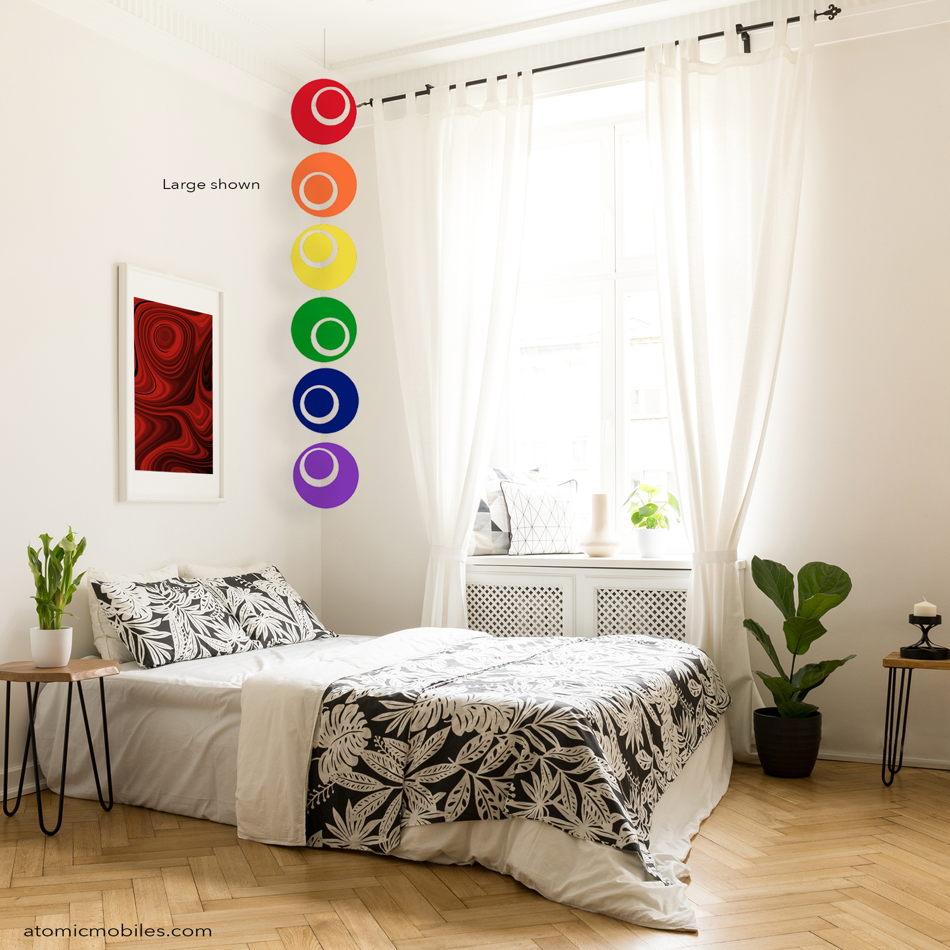 Cozy and beautiful urban  bedroom with LGBTQ+ Gay PRIDE Rainbow Groovy hanging vertcal art mobile by AtomicMobiles.com