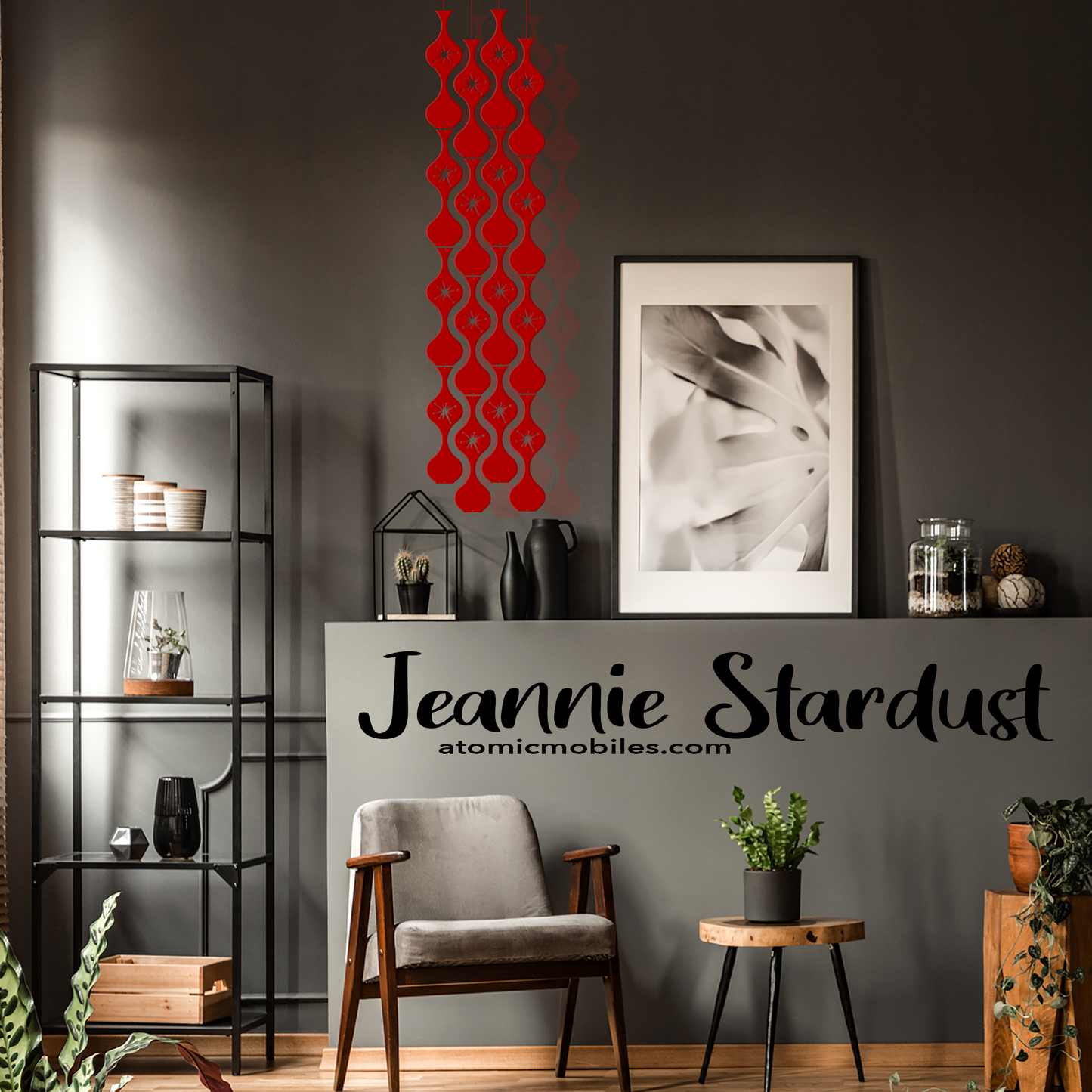 Charming Jeannie Stardust kinetic hanging art mobile in transparent red in dark gray room with modern chair and plants - mid century modern style art mobiles by AtomicMobiles.com