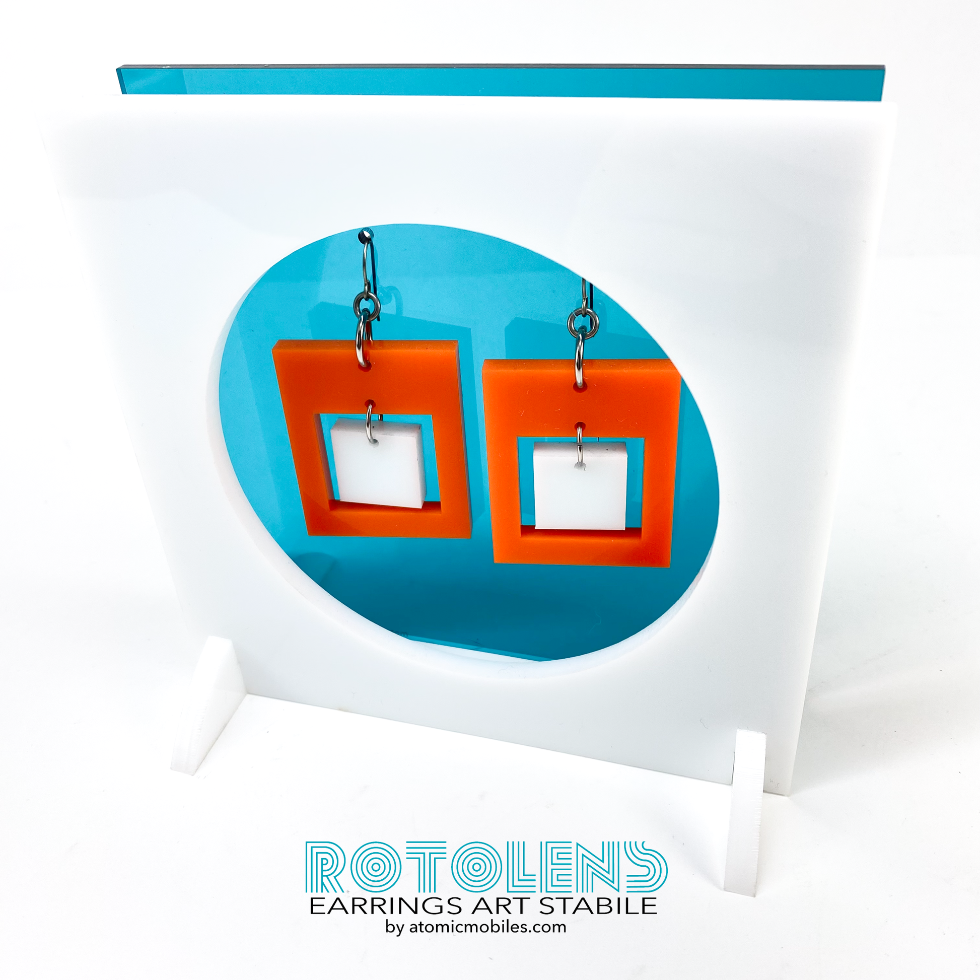 Stunning Art Earrings Stabile Set featuring transparent teal backing with orange and white earrings - mid century modern art for Groovy People by AtomicMobiles.com