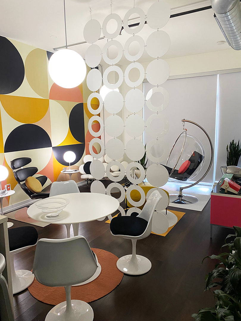 Groovy circles room divider in white in mod apartment with mod furniture -- mobile divider by AtomicMobiles.com