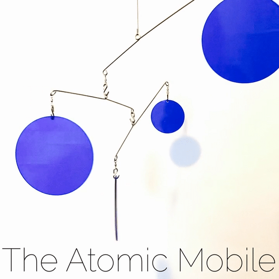Beautiful Navy Blue Hanging Jetsetter XL Art Mobile in motion - The Atomic Mobile animated gif of Clear Acrylic Plexiglass by AtomicMobiles.com