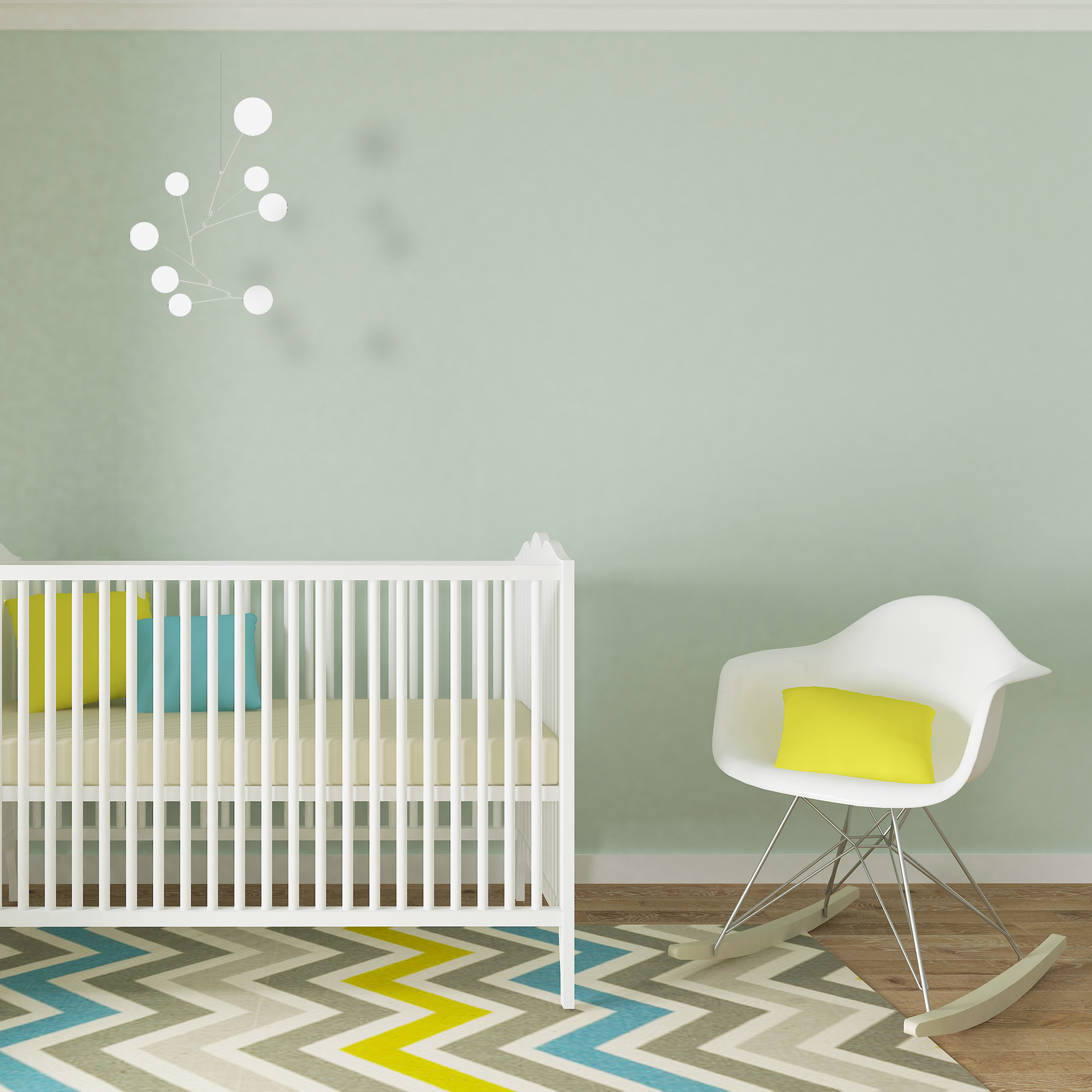 Delightful Exuberant Hanging Art Mobile in all white in lovely modern baby nursery with crib, eames rocking chair, and geometric rug - mid century modern inspired hanging kinetic art by AtomicMobiles.com