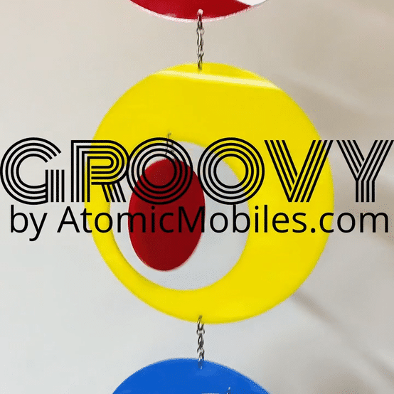 Groovy Hanging Art Mobile in kinetic motion in red, blue, yellow, and green by AtomicMobiles.com