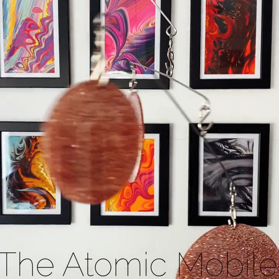 Animated gif of The Atomic Mobile in Rose Gold Glitter Acrylic - hanging art mobiles by AtomicMobiles.com