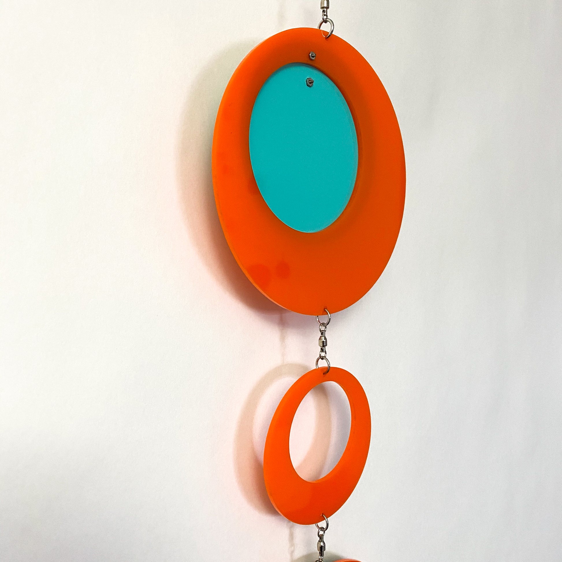 Back of Palm Springs Retro Vertical Hanging Mobile in Palm Springs Colors of Orange, Aqua, and Lime by AtomicMobiles.com