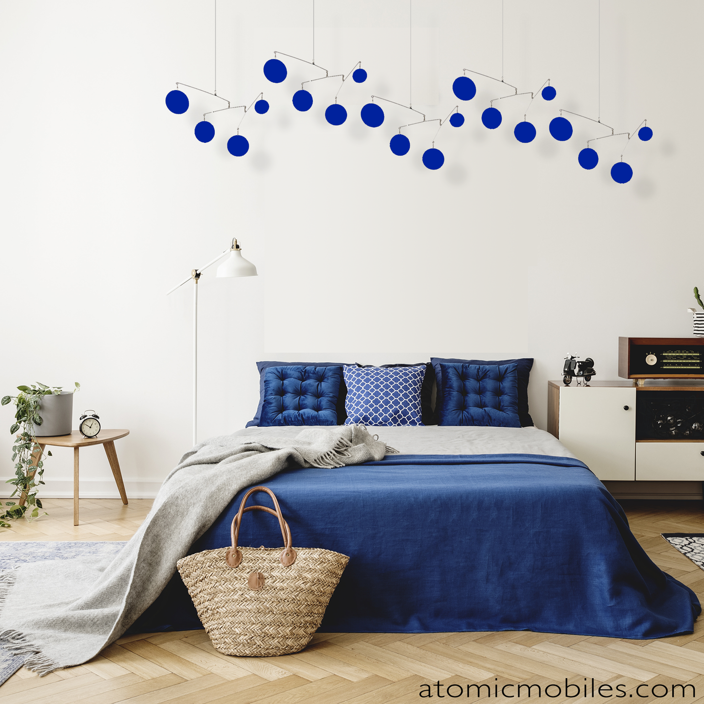 The Atomic Mobile in cozy bedroom in shades of navy blue by AtomicMobiles.com