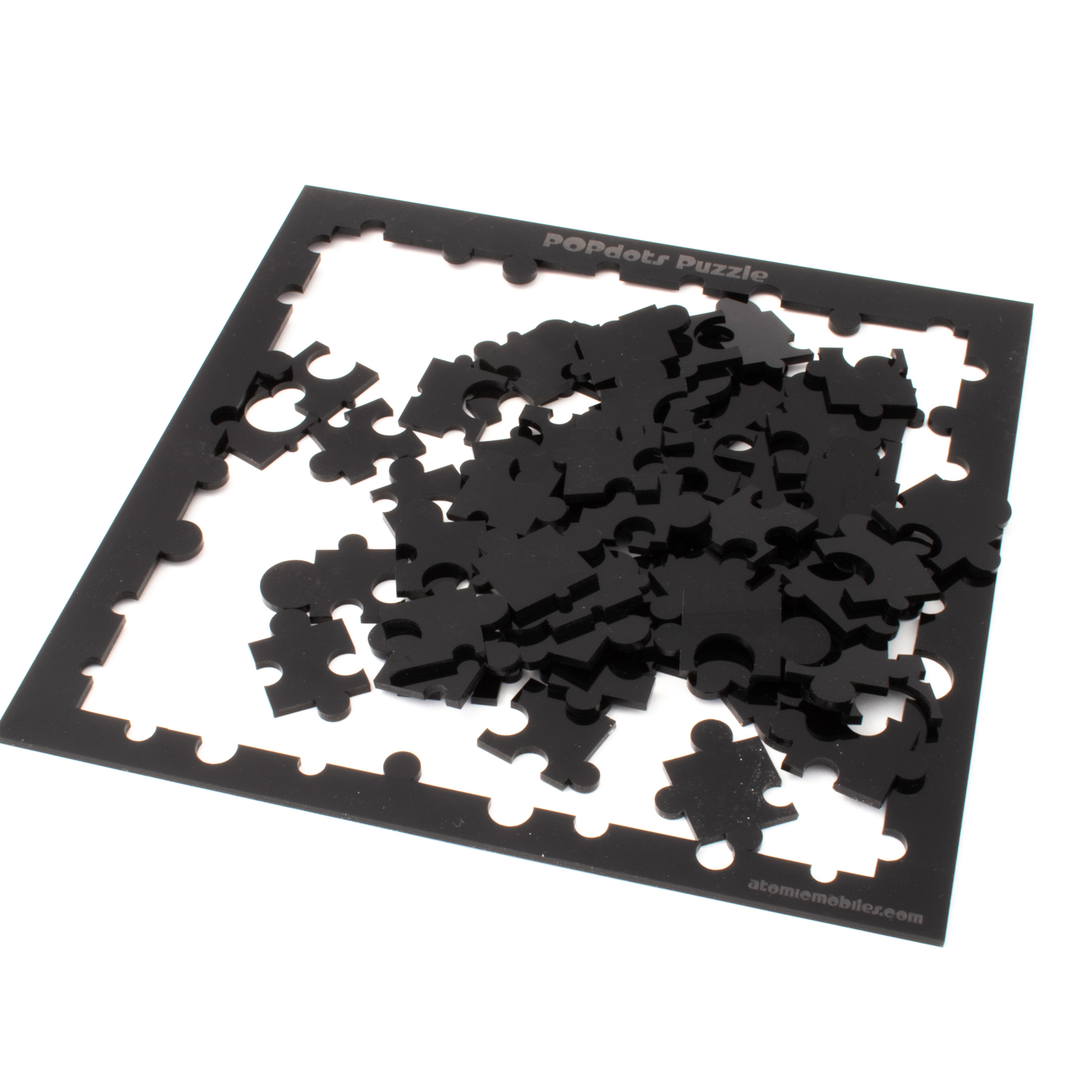 Modern glossy black acrylic jigsaw puzzle designed by AtomicMobiles.com