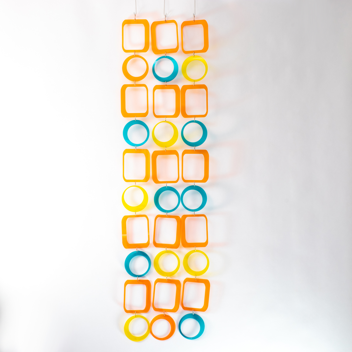 Full view of Beautiful DIY Kit to make mobile, room divider, window treatment, or wall art in clear orange, teal, yellow by AtomicMobiles.com 