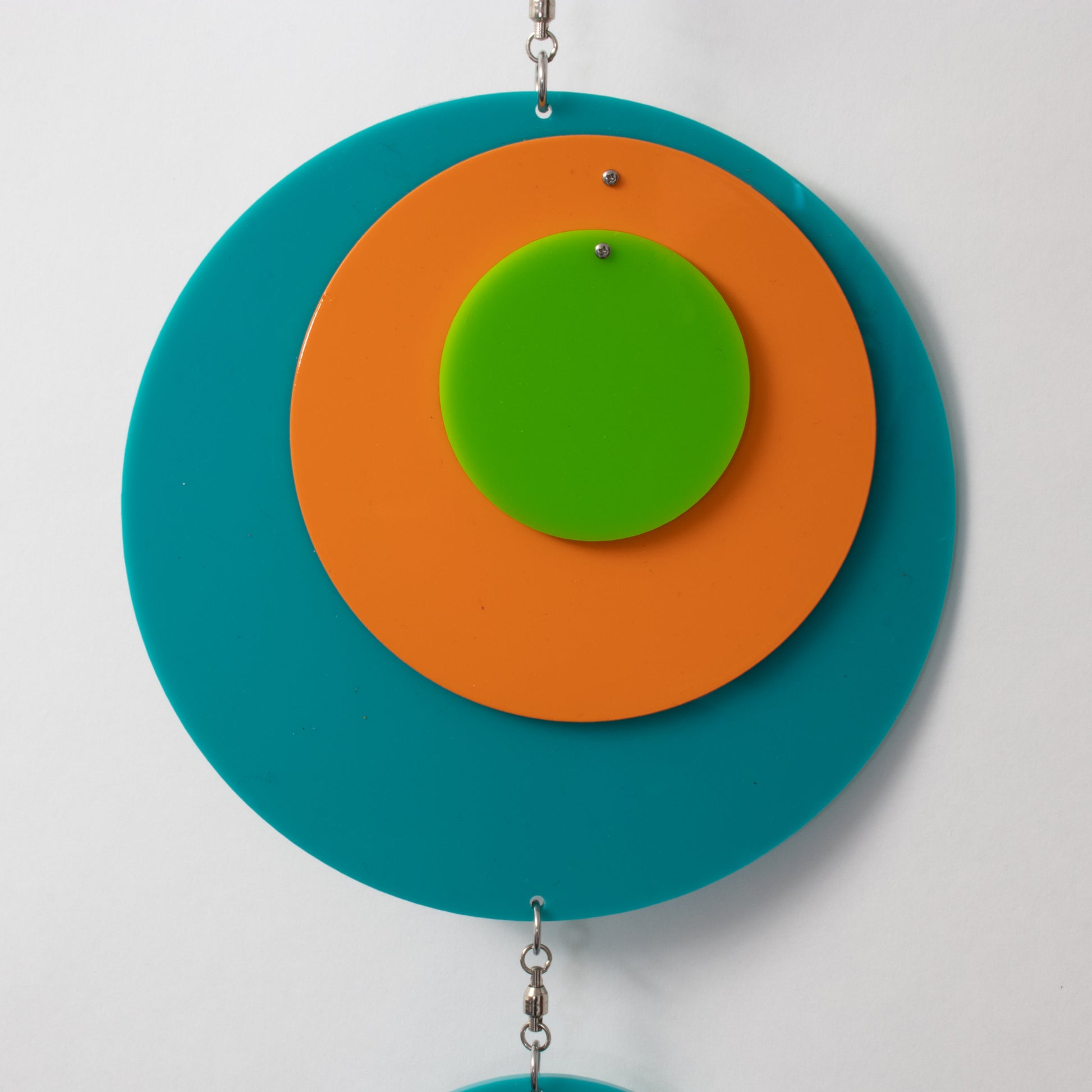 Closeup of beautiful Palm Springs Wall Art Mobile in Aqua Blue, Orange, and Lime Green by AtomicMobiles.com