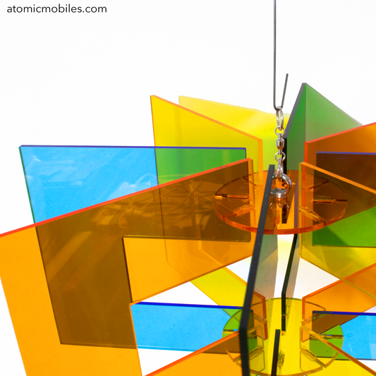 Space Age RotaMobile - beautiful rotating kinetic hanging art mobile in clear acrylic colors of Orange, Yellow, Blue and Green by AtomicMobiles.com
