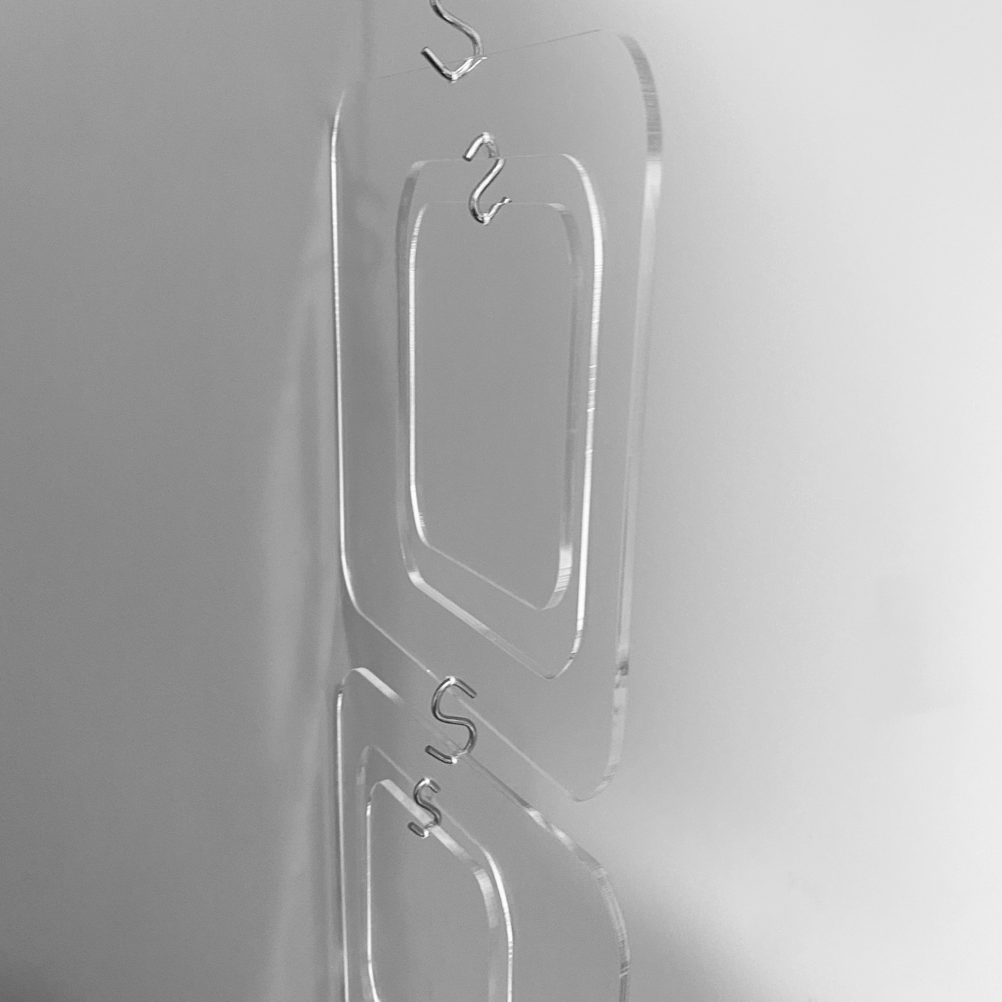 Closeup of Coolsville DIY KIT for mobiles, room dividers, and curtains  in Clear Lucite Acrylic by AtomicMobiles.com