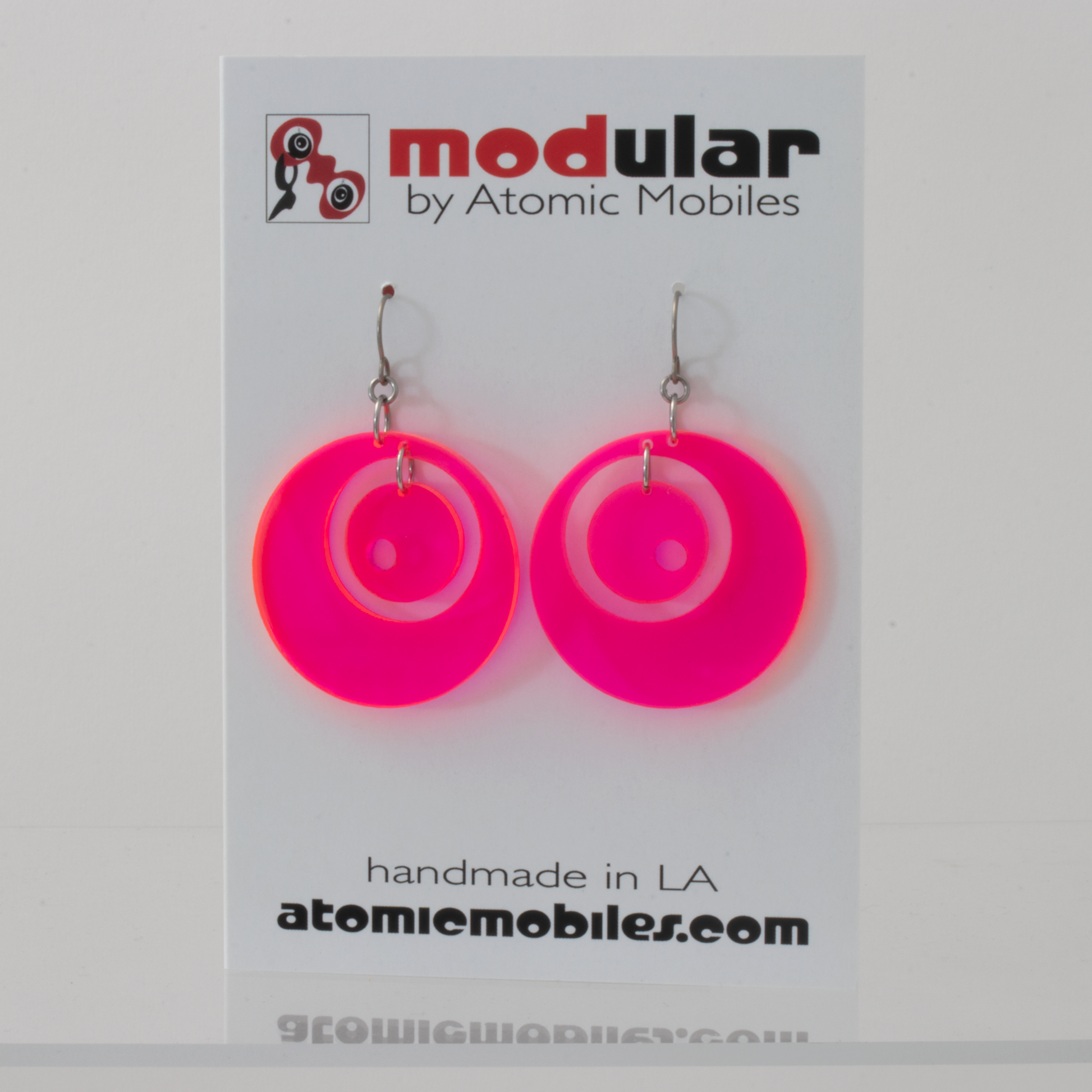 Groovy 1960s Mid Century Modern Style Earrings in Neon Fluorescent Hot Pink plexiglass acrylic by AtomicMobiles.com