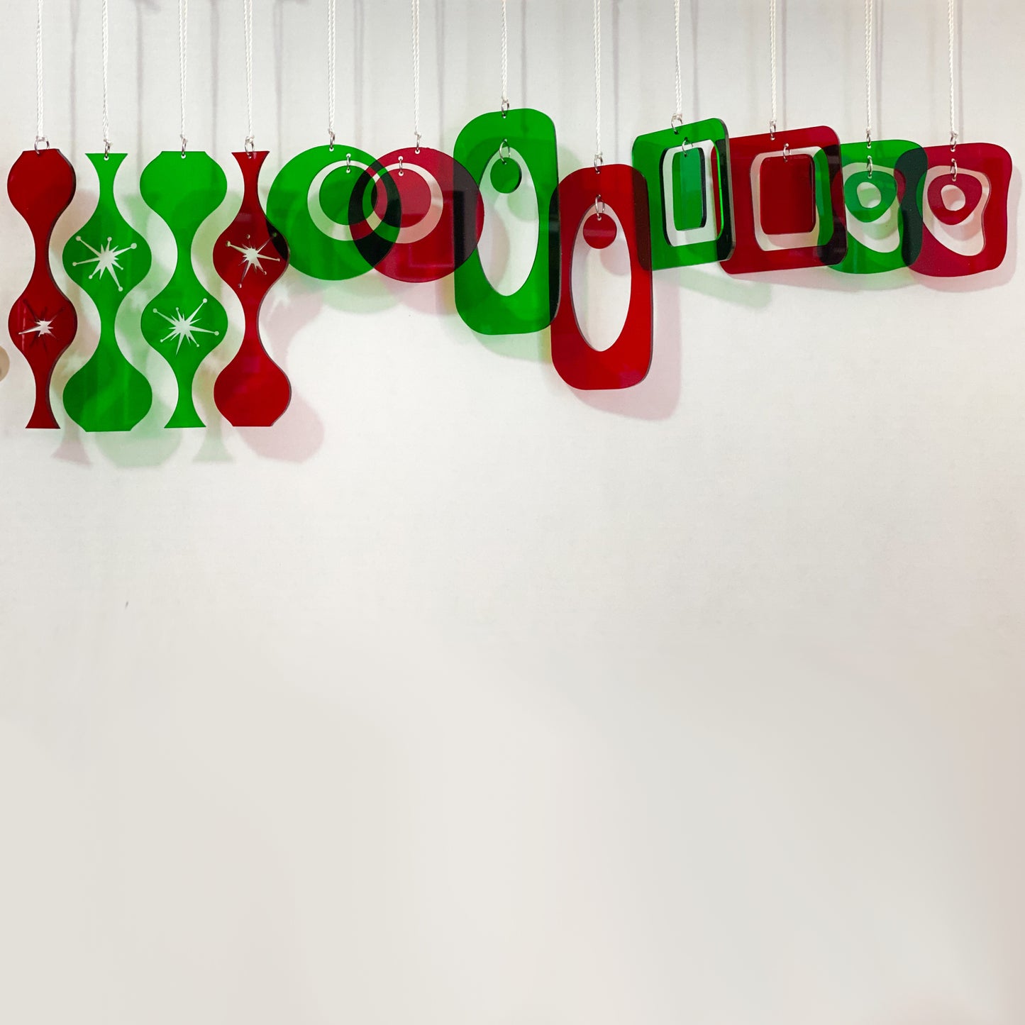 12 Sets of gorgeous transparent red and green mid century modern style Christmas Ornaments for your Christmas tree by AtomicMobiles.com