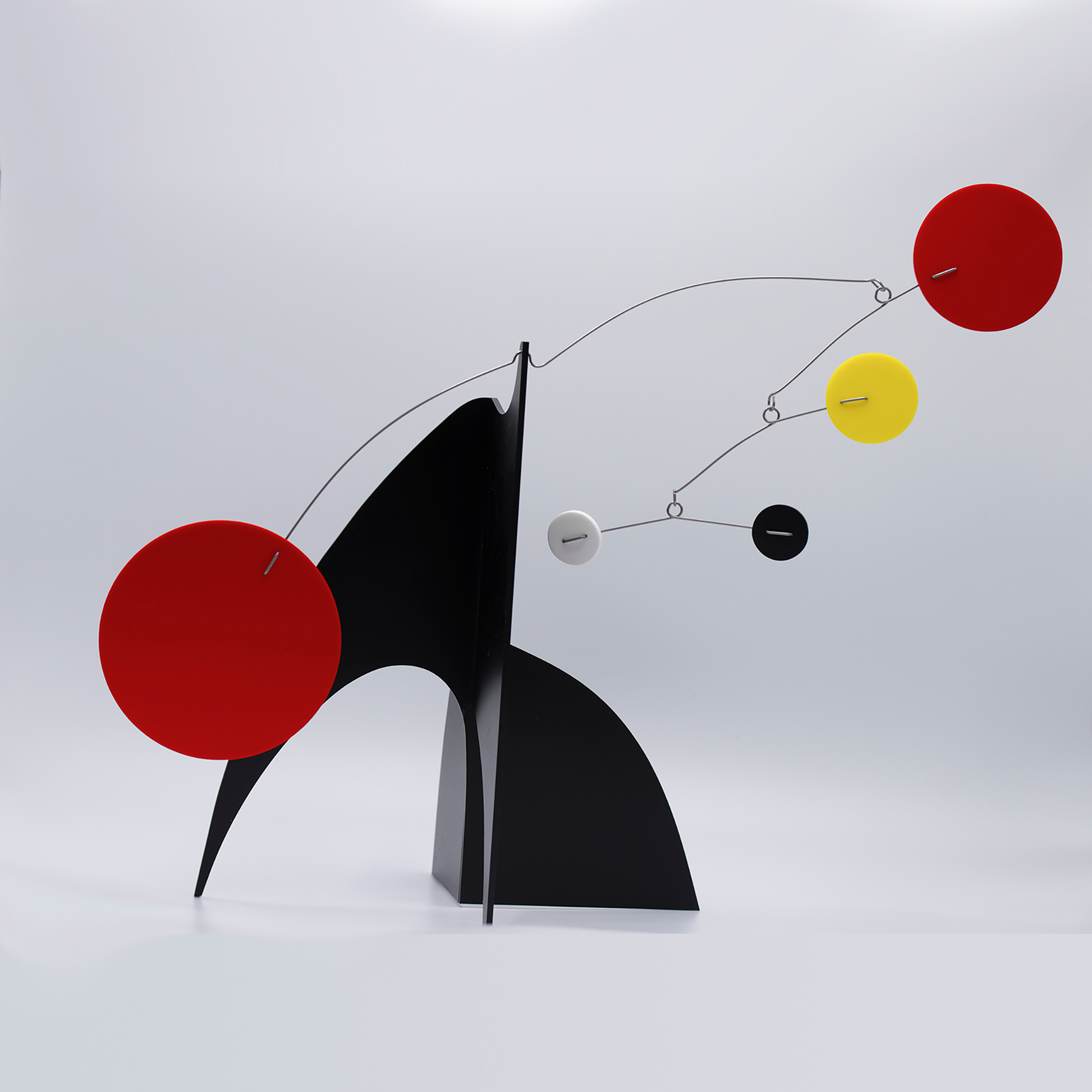 Beautiful Moderne Art Stabile in black, red, yellow, and white - mid century modern inspired abstract modern art - tabletop kinetic art sculpture mobiles hand made with glossy plexiglass acrylic in Los Angeles by Debra Ann of AtomicMobiles.com