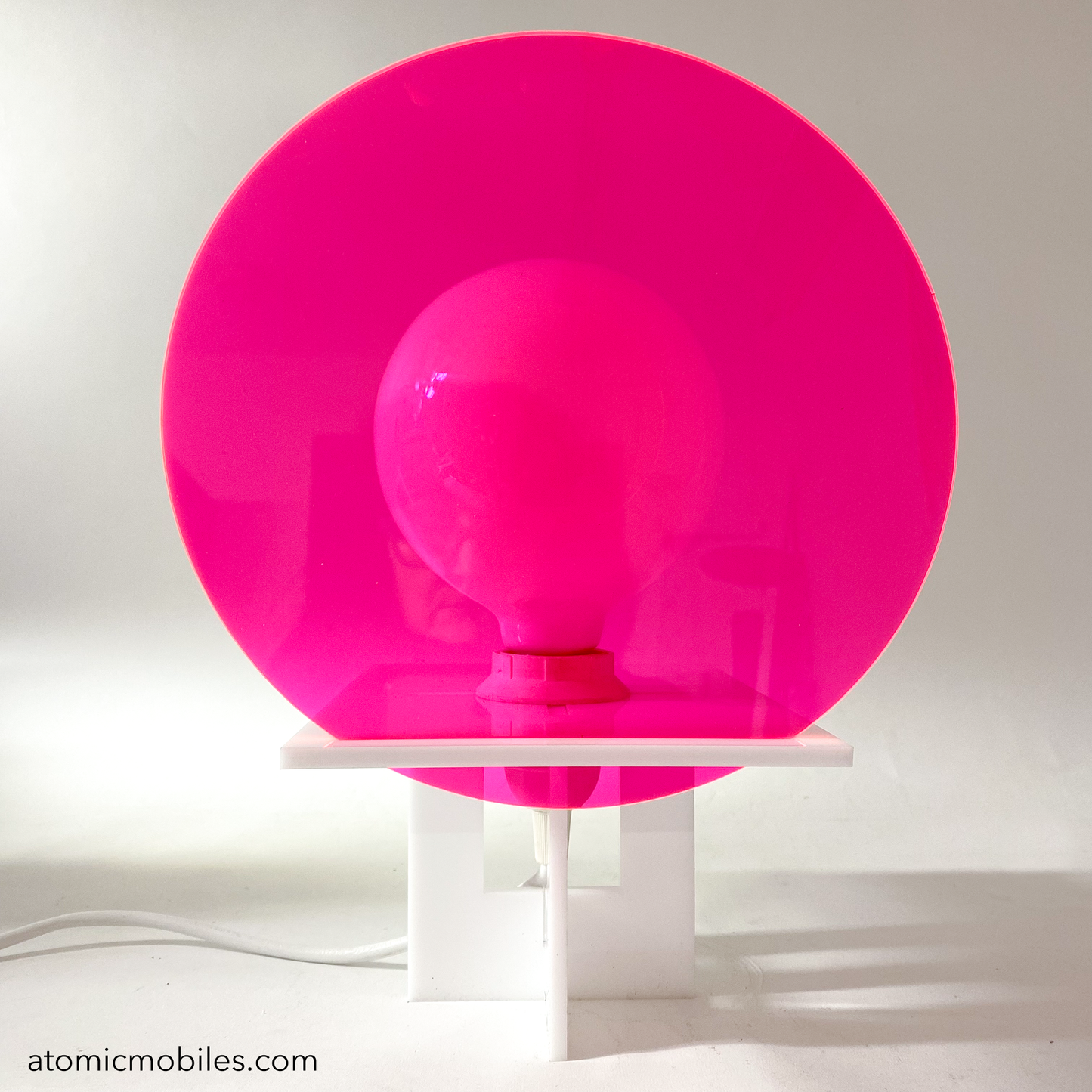 RETROSPECT Space Age Lamp by AtomicMobiles.com with Fluorescent Pink Neon round lens cover over globe light bulb