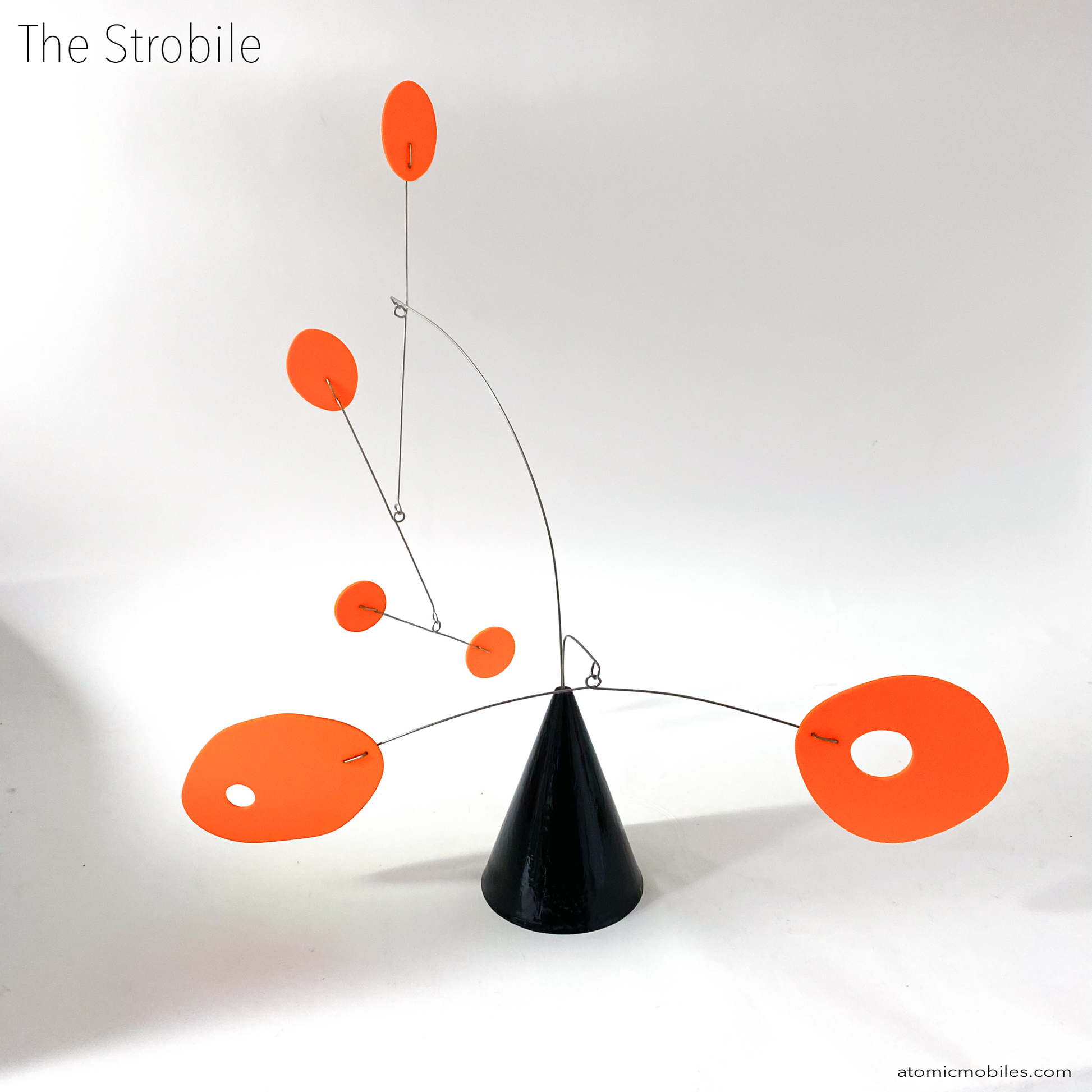 The Strobile table top kinetic art sculpture in Tangerine Orange and Black by AtomicMobiles.com