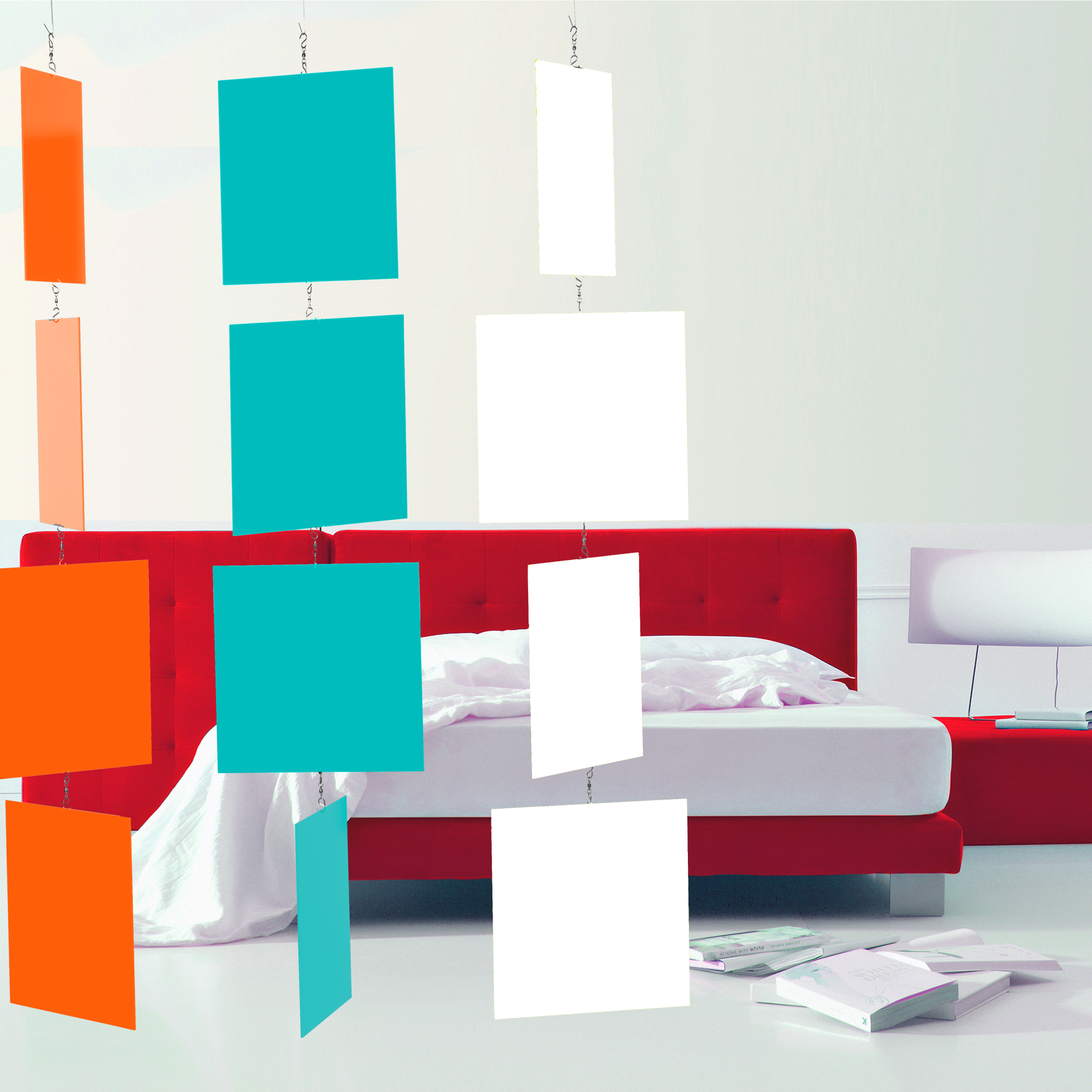 Modern bed with red velvet headboard and white room with books and lamp with MODcast hanging art mobiles in Palm Springs colors of Orange, Aqua Blue, and White by AtomicMobiles.com