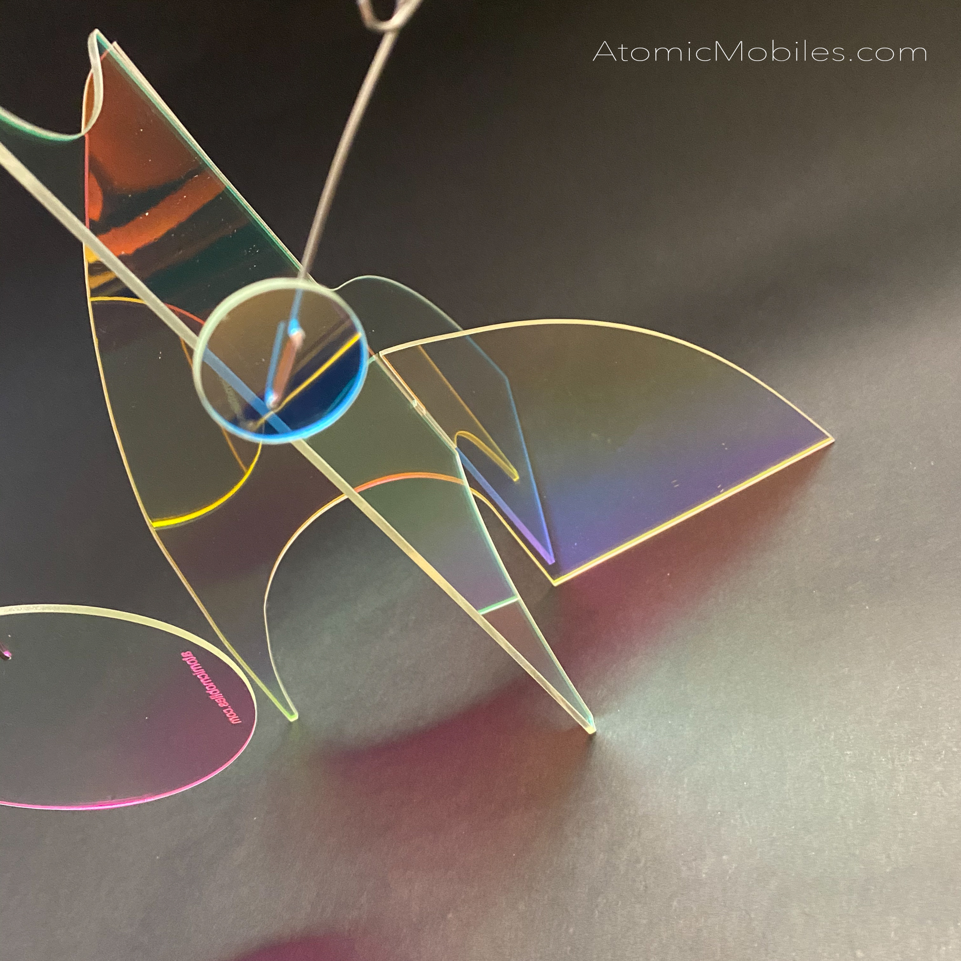 close up of fascinating prism iridescent modern art stabile sculpture by AtomicMobiles.com