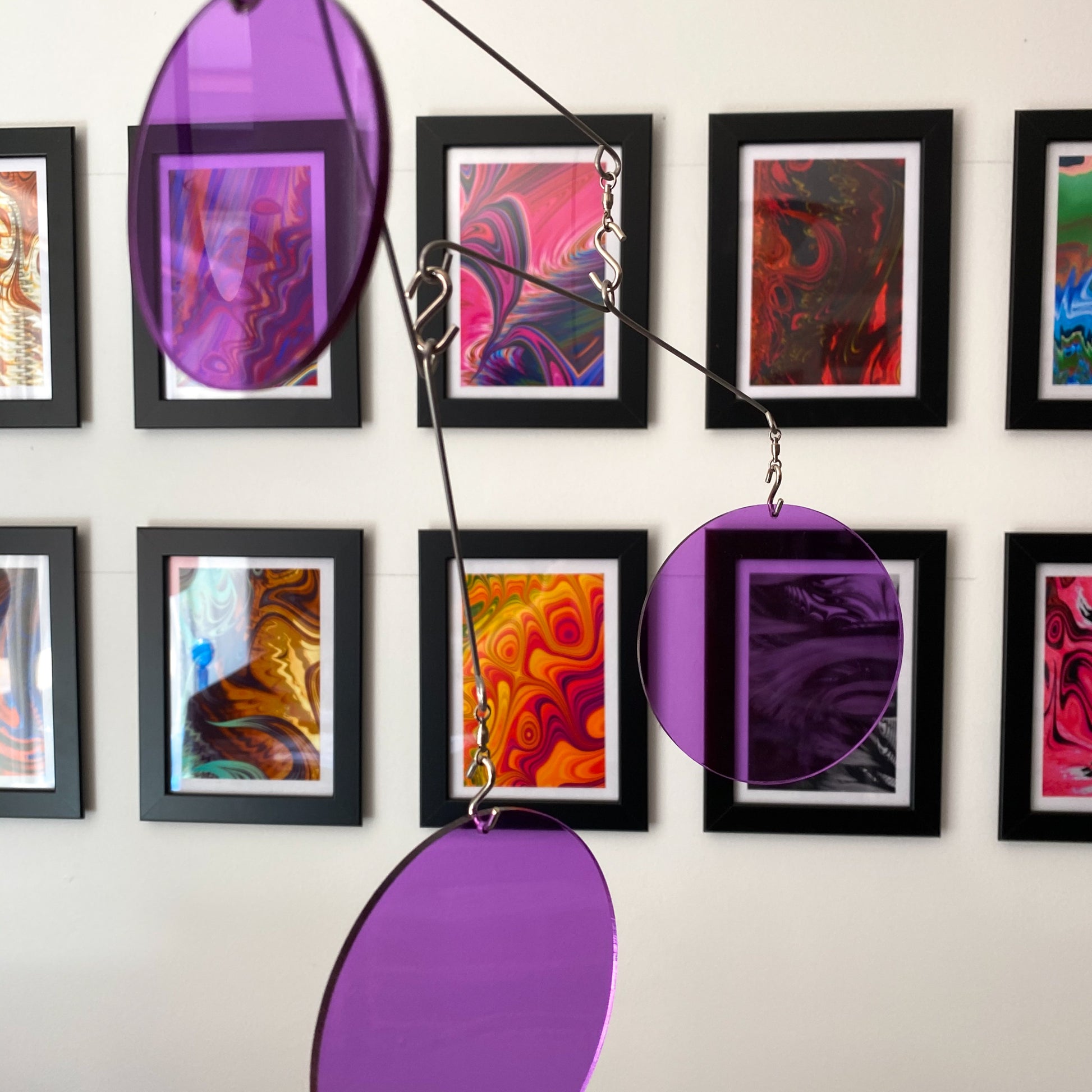 Clear Purple Acrylic Atomic Mobiles in front of MiniMOD abstract colorful art prints by AtomicMobiles.com