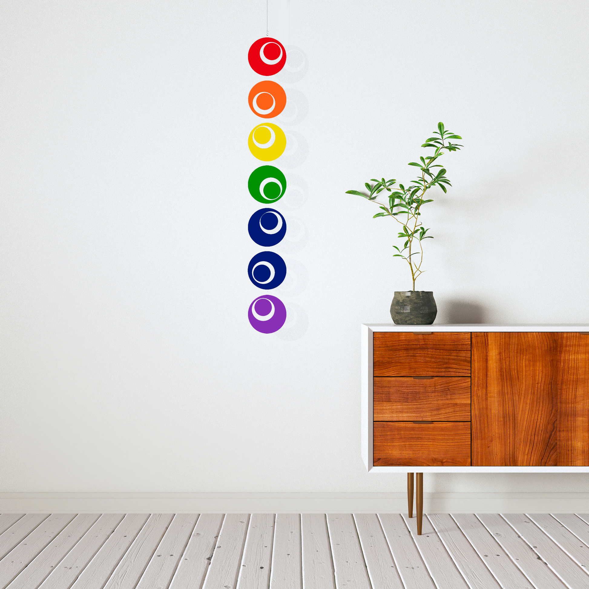 Modern credenza with plant and Rainbow Hanging Art Mobile by AtomicMobiles.com