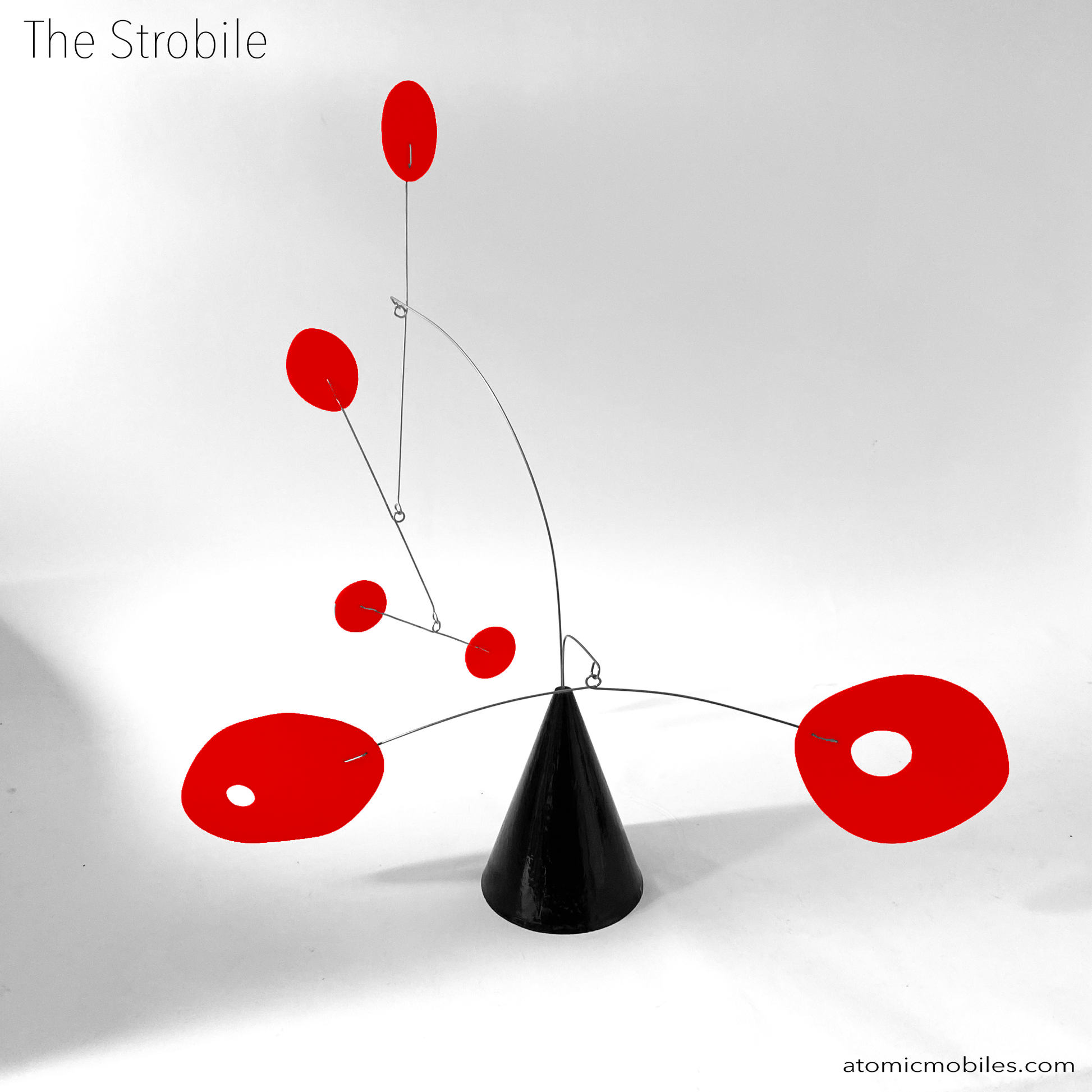 The Strobile table top kinetic art sculpture in red and black by AtomicMobiles.com