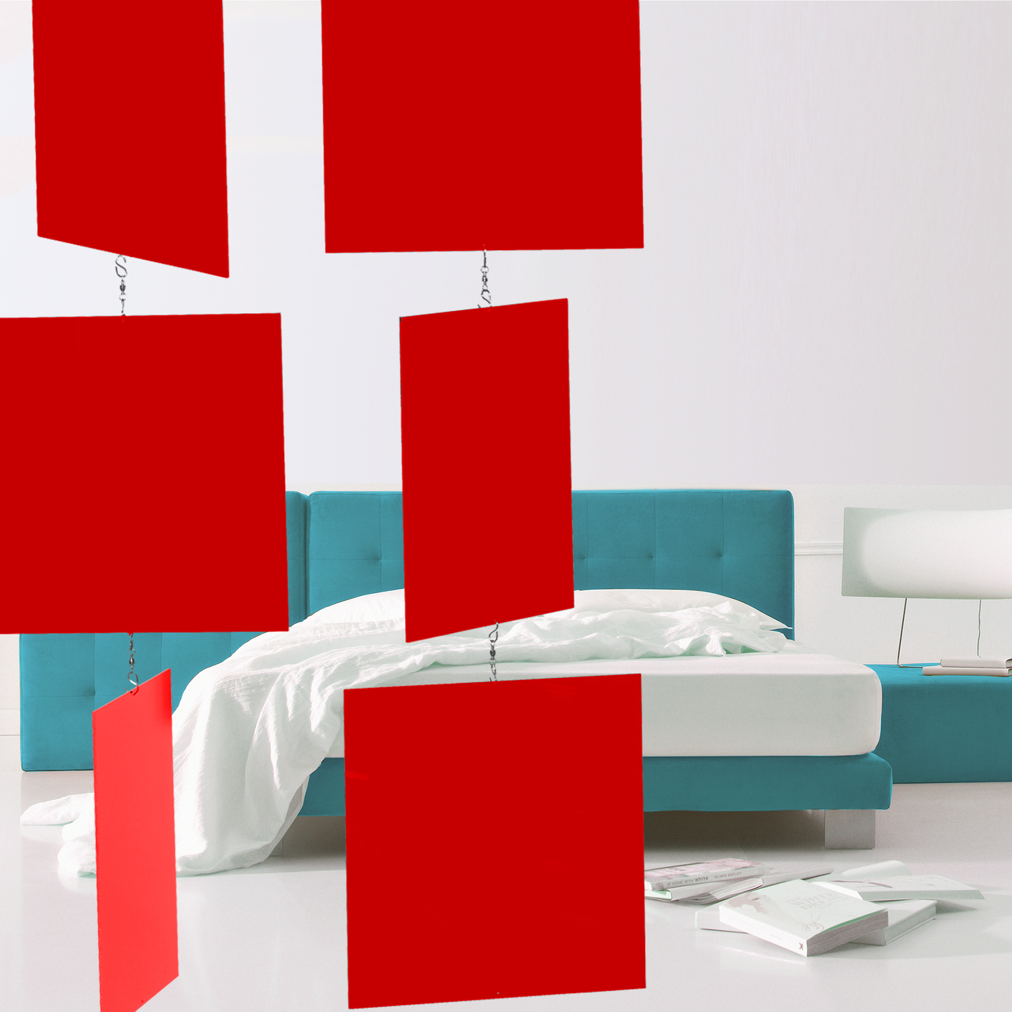 Modernist bedroom with aqua bed frame, white linens, books and a modern lamp with red MODcast kinetic hanging art mobiles / room divider - handmade in Los Angeles by AtomicMobiles.com