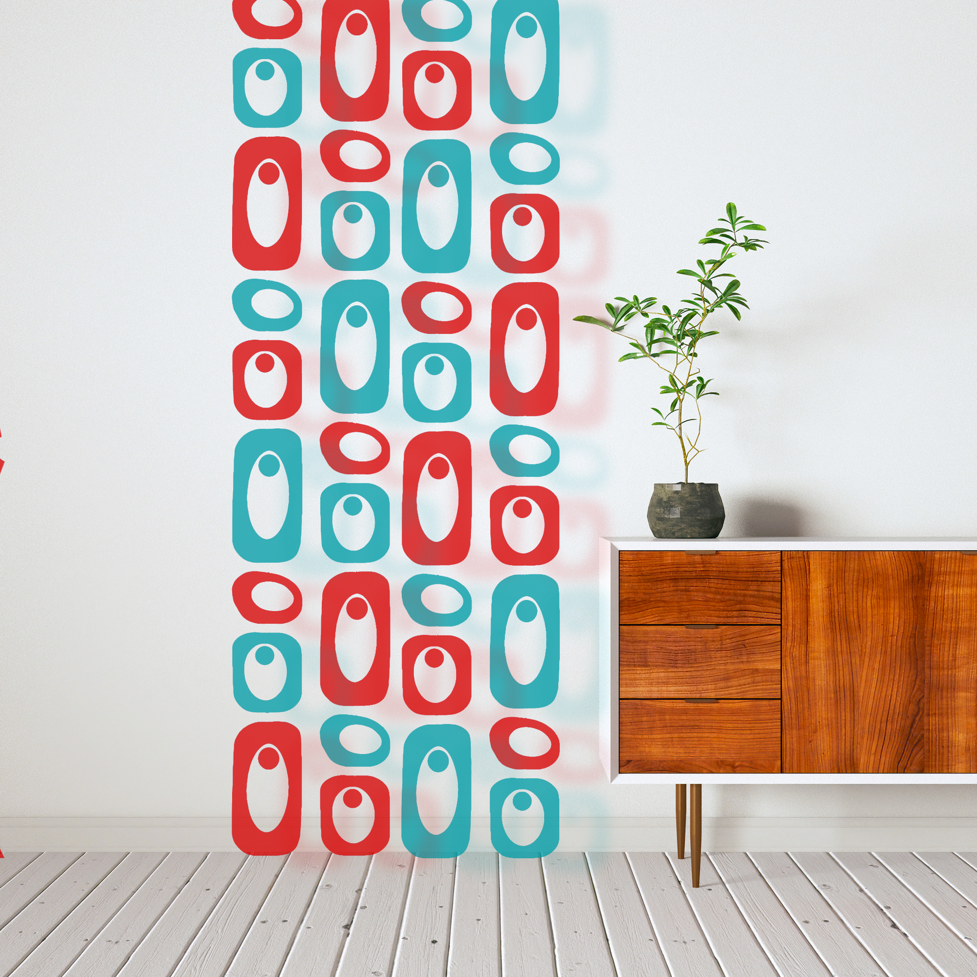 Clear Red and Teal acrylic retro room divider in 4 columns next to mid century modern wood sideboard credenza and plant - Beatnik Party Retro Room DIvider by AtomicMobiles.com