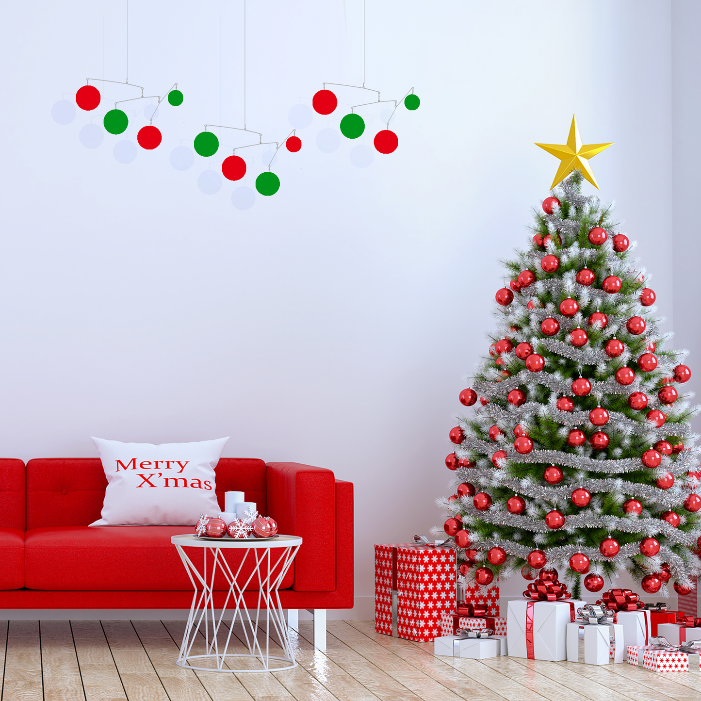 Christmas tree with ornaments and gifts next to mid century modern red sofa with 3 hanging art mobiles in red and green by AtomicMobiles.com