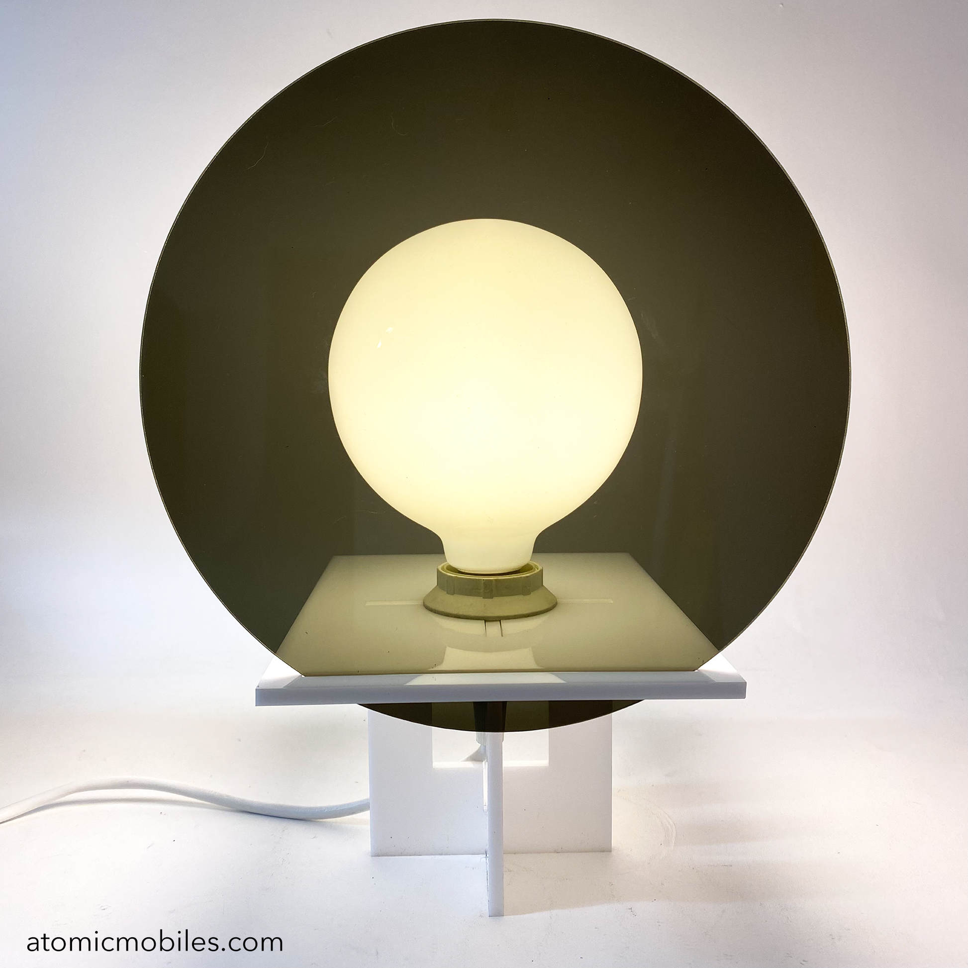 RETROSPECT Space Age Lamp by AtomicMobiles.com with Smoky Gray round lens cover over globe light bulb