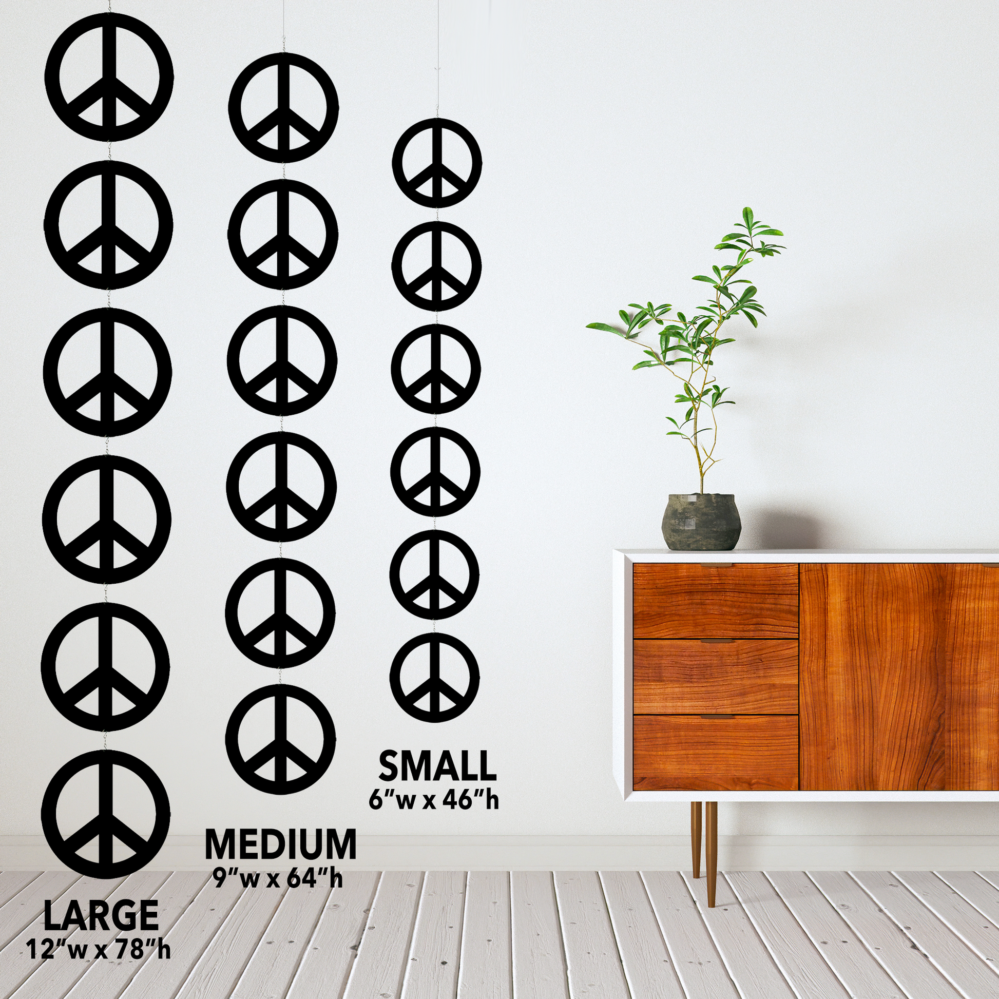 Size Examples for Peace Mobile by AtomicMobiles.com - calm mid century room with modern credenza and plant with wood floor and 3 sets of Peace Sign Kinetic Hanging Art Mobiles