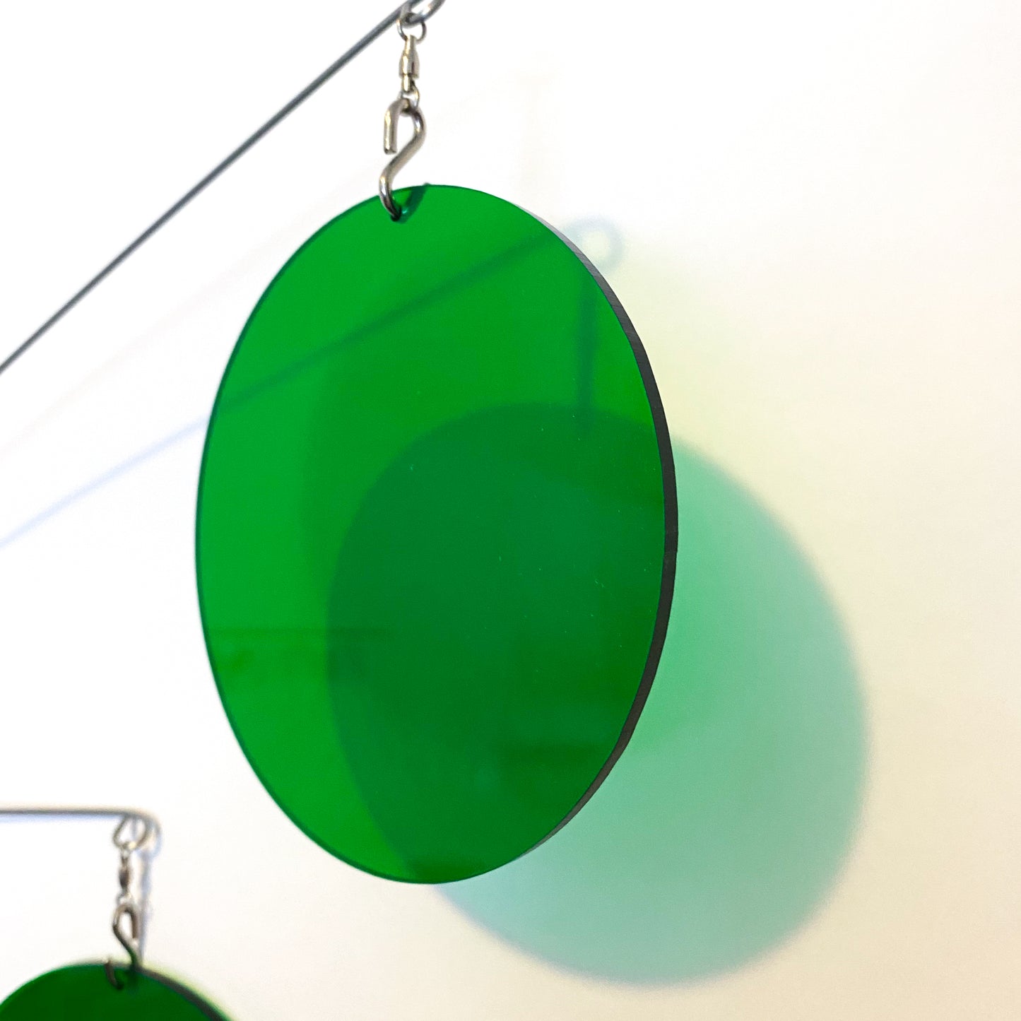 Closeup of Clear Green Acrylic Atomic Mobile - kinetic hanging art mobiles for modern home decor by AtomicMobiles.com