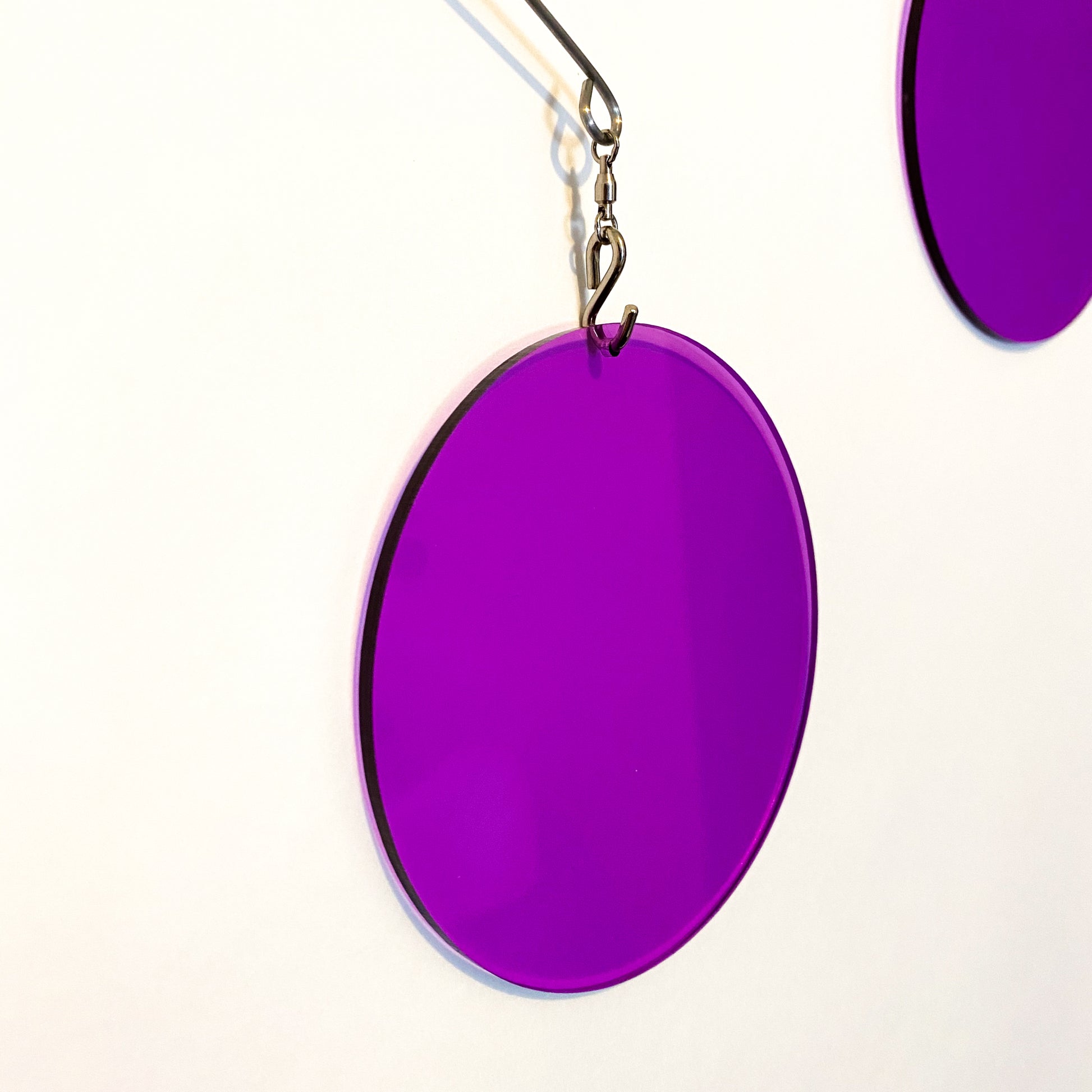 Closeup of Clear Purple Acrylic Atomic Mobile - kinetic hanging art mobiles for modern home decor by AtomicMobiles.com