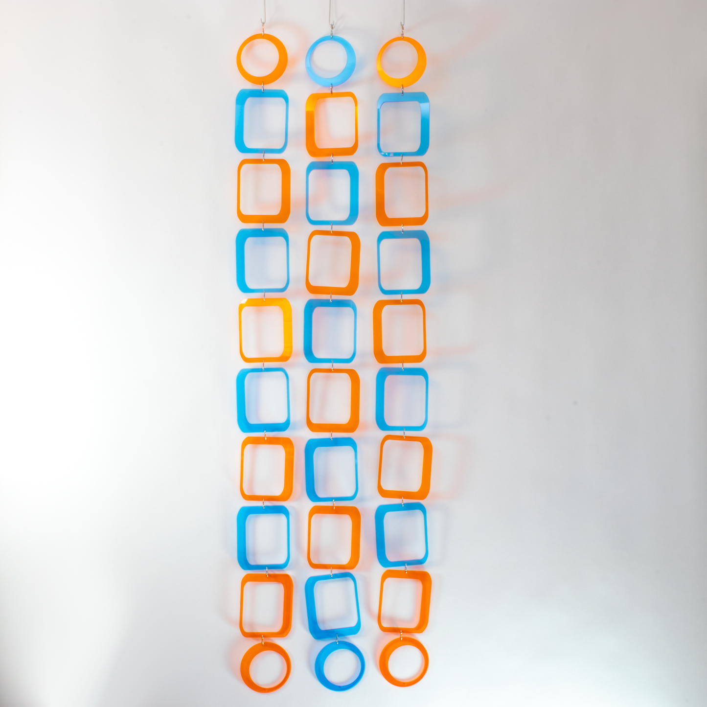 Stunning blue and orange clear acrylic retro 1970s room divider, window curtain, wall art, and mobile DIY Kit by AtomicMobiles.com