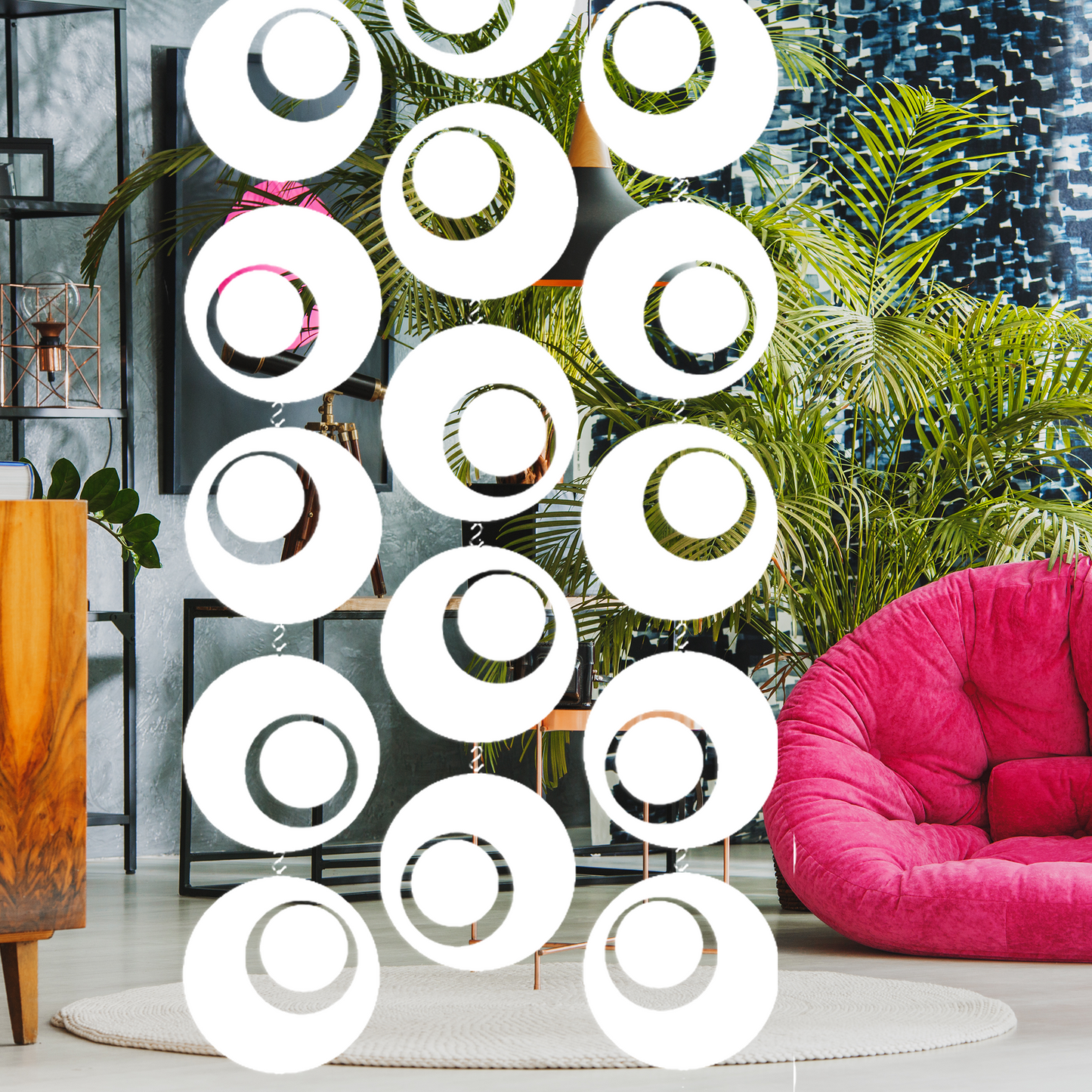 Groovy White hanging mobiles as a room divider in mod room with hot pink bean bag chair and plants - mobiles by AtomicMobiles.com